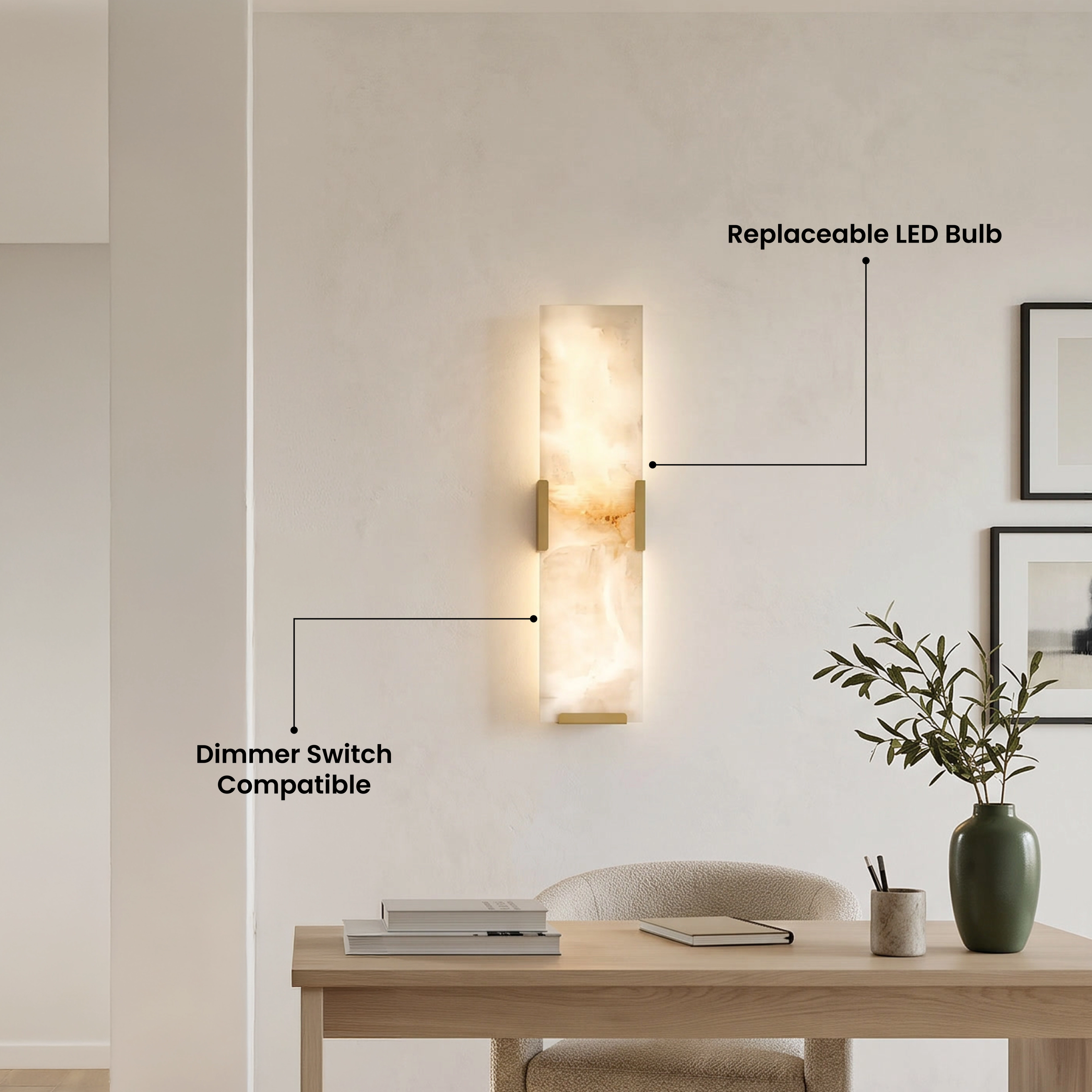 Rhea faceted alabaster wall sconce glowing above a living-room sofa; notes natural alabaster and replaceable LED bulb