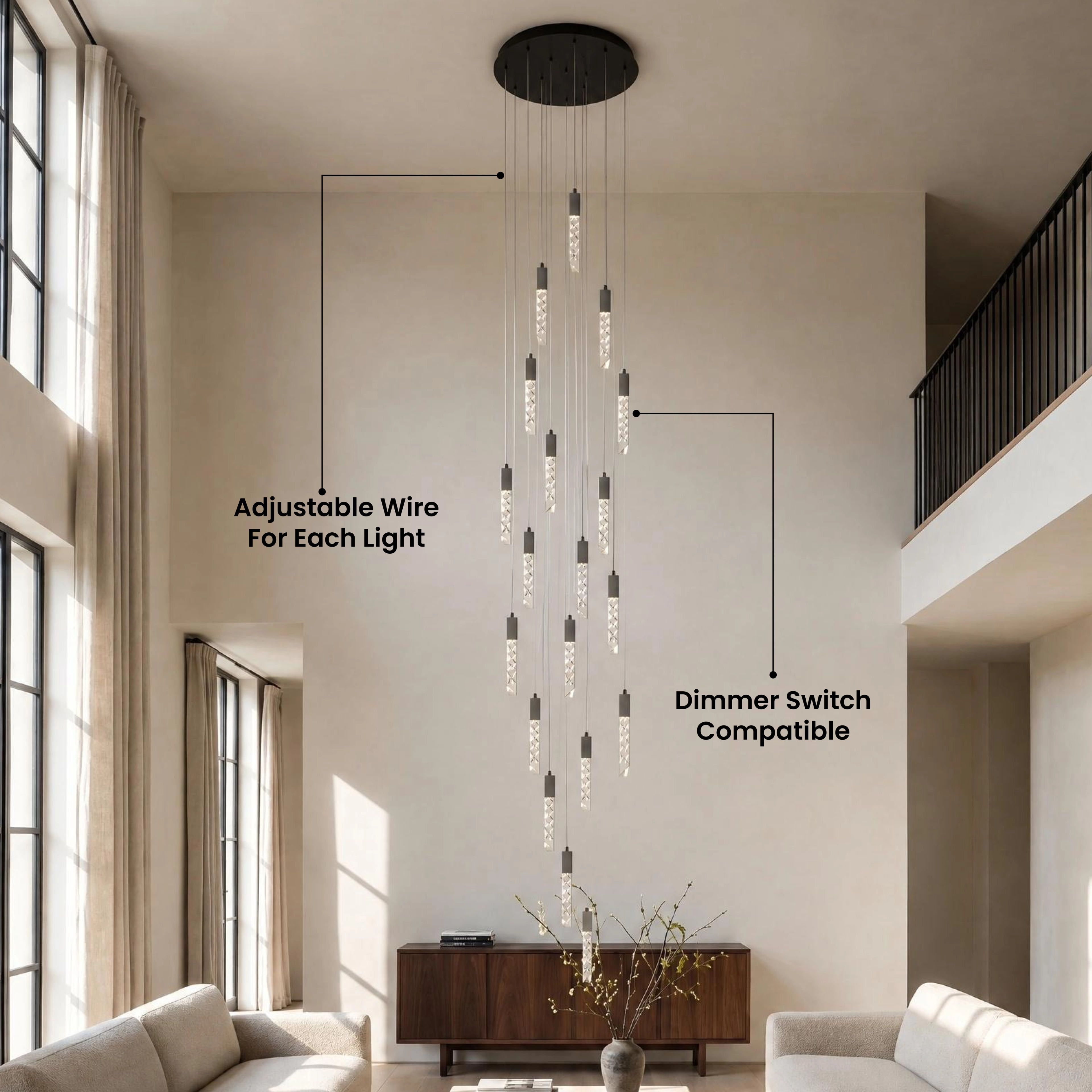Cosmo black crystal-bar pendants, two slim glowing rods hanging beside a sofa in a gray living room