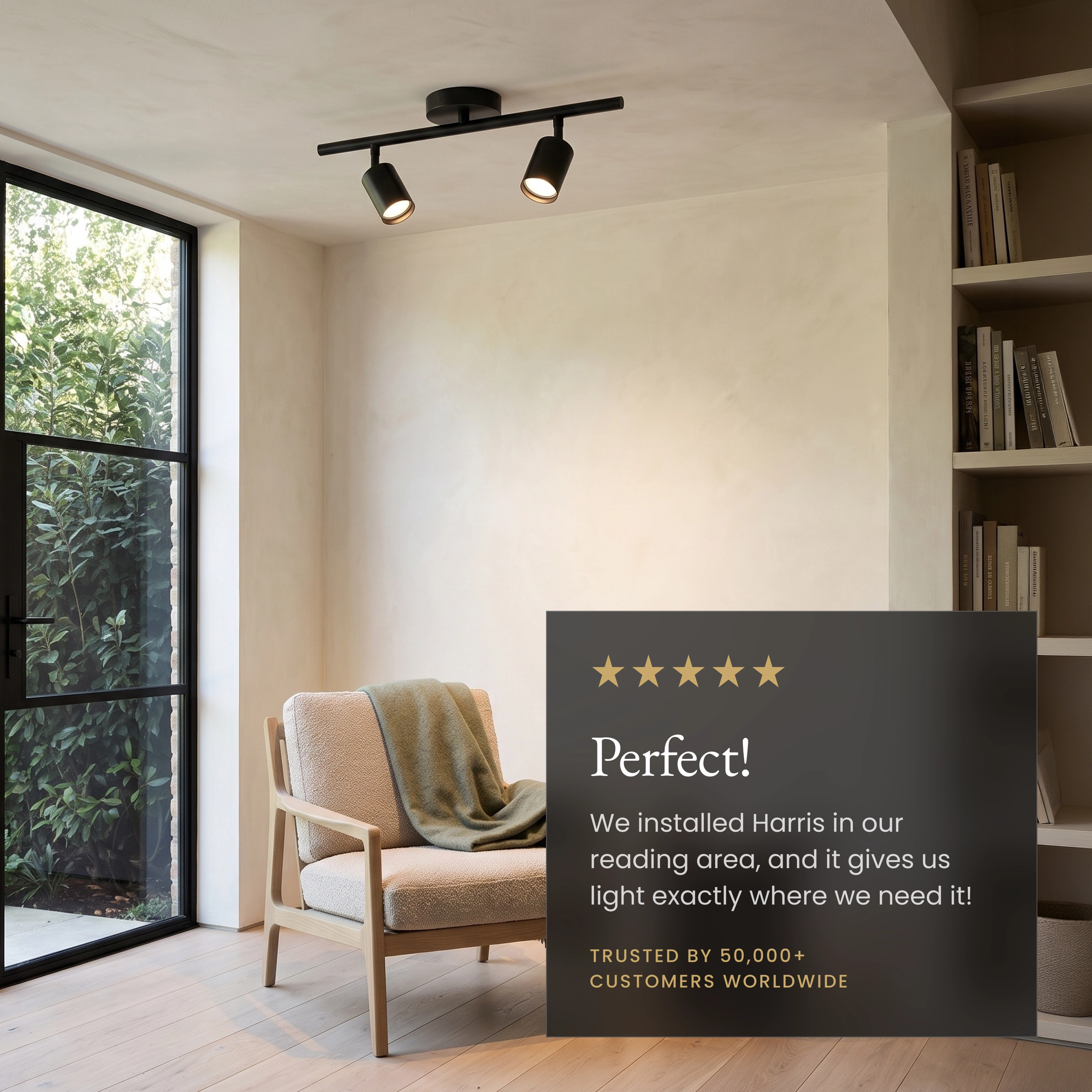 Harris black cylinder spotlight mounted on a bedroom wall, labeled dimmer-compatible and rotatable for slanted ceilings