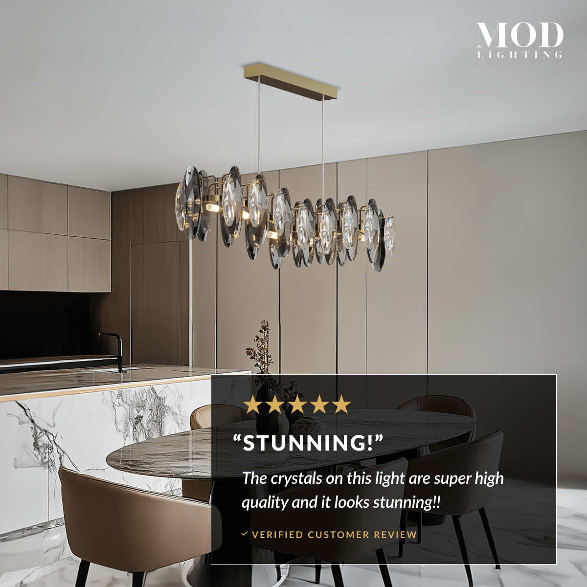Celestial gold linear crystal pendant over a dining table in a modern kitchen, customer review overlay