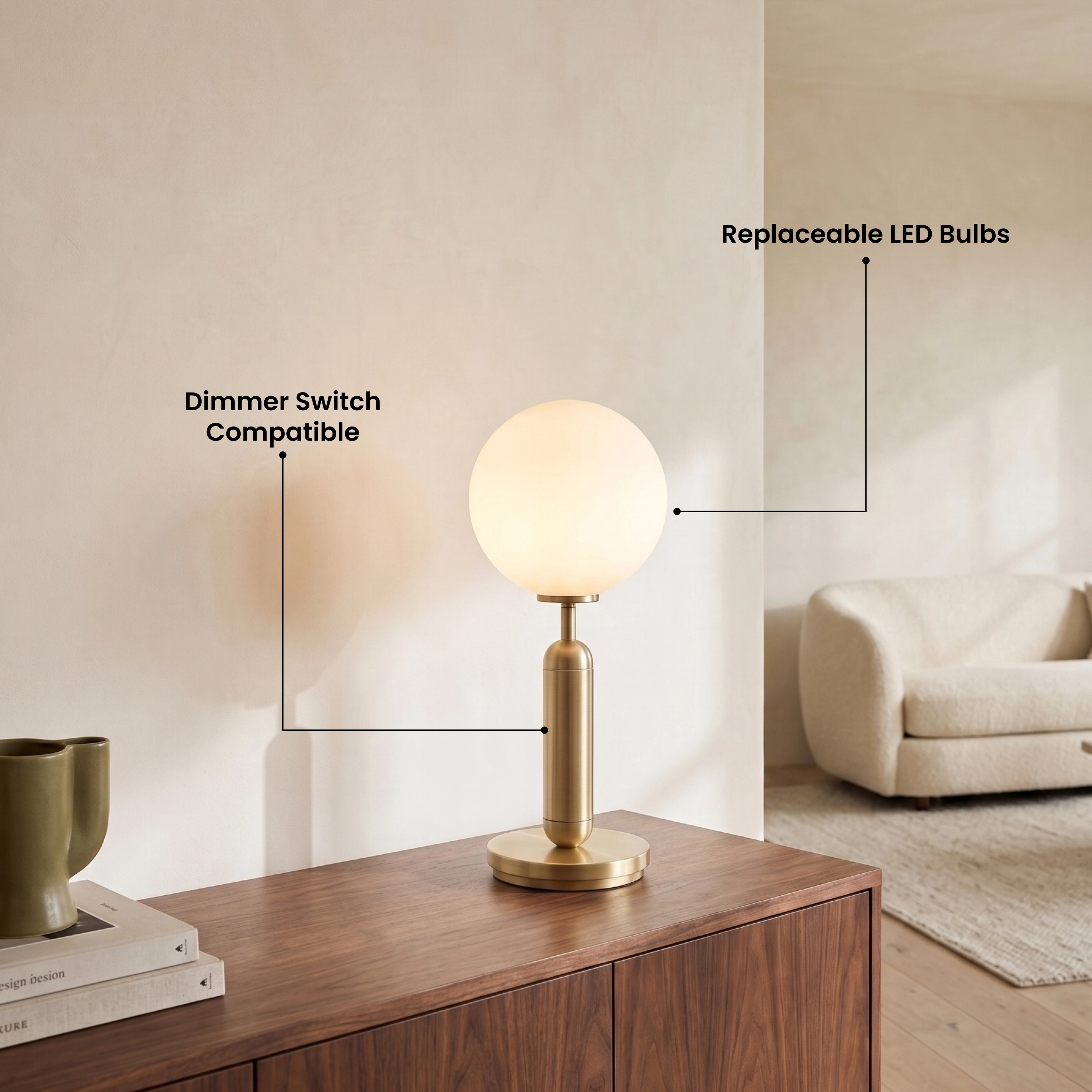 Angelica gold table lamp, white opal-glass globe on a brushed-brass stem and base, on a desk by a window