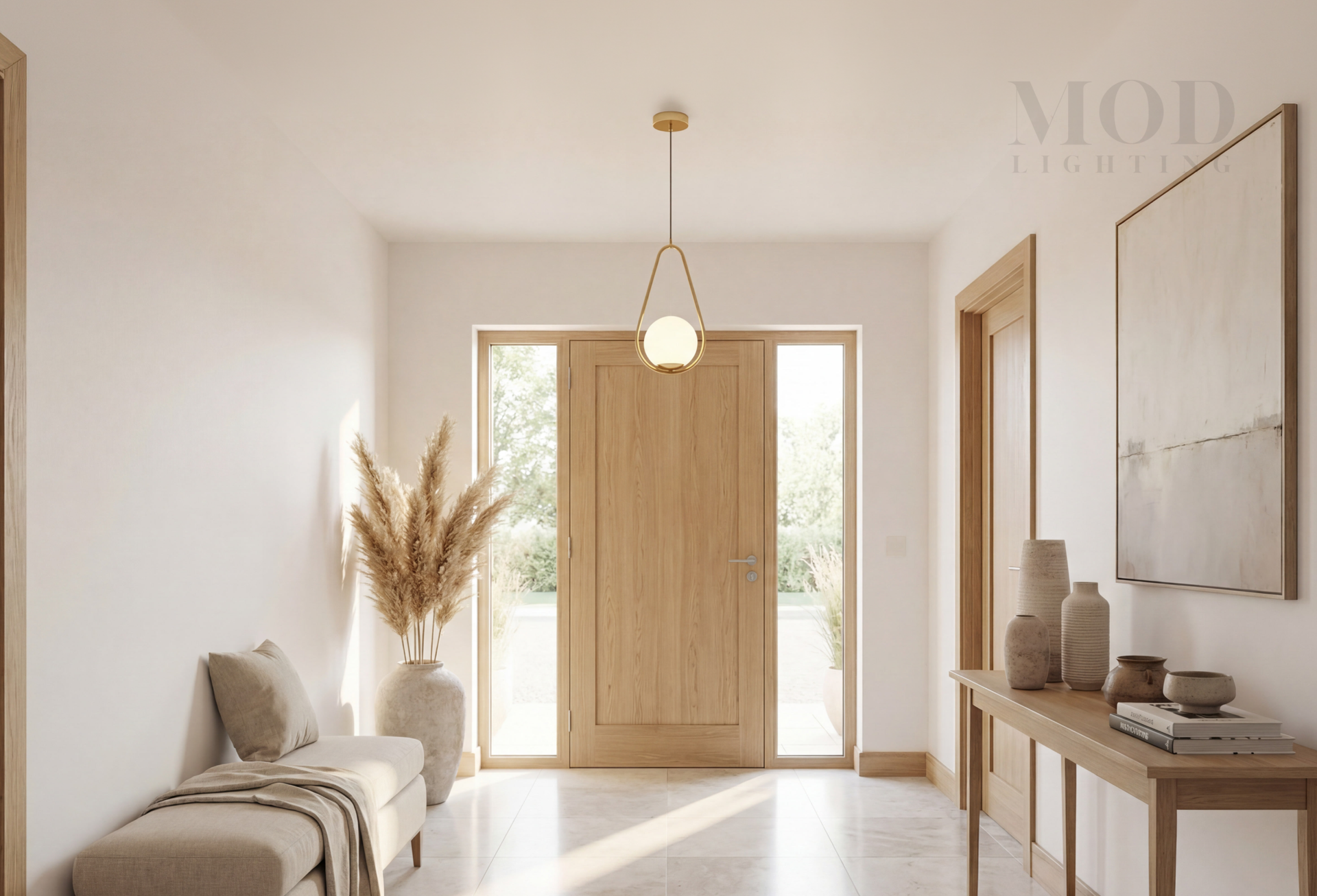 Minimal brass pendant in a clean modern entryway
