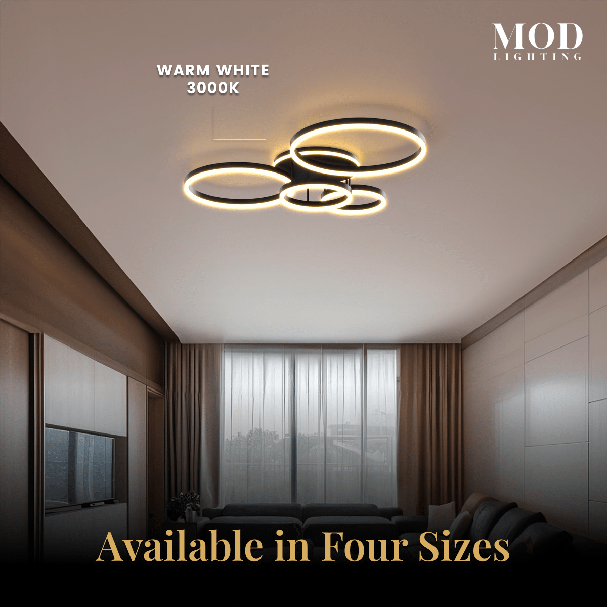Chloe ceiling light, four gold LED rings in a living room; available in four sizes