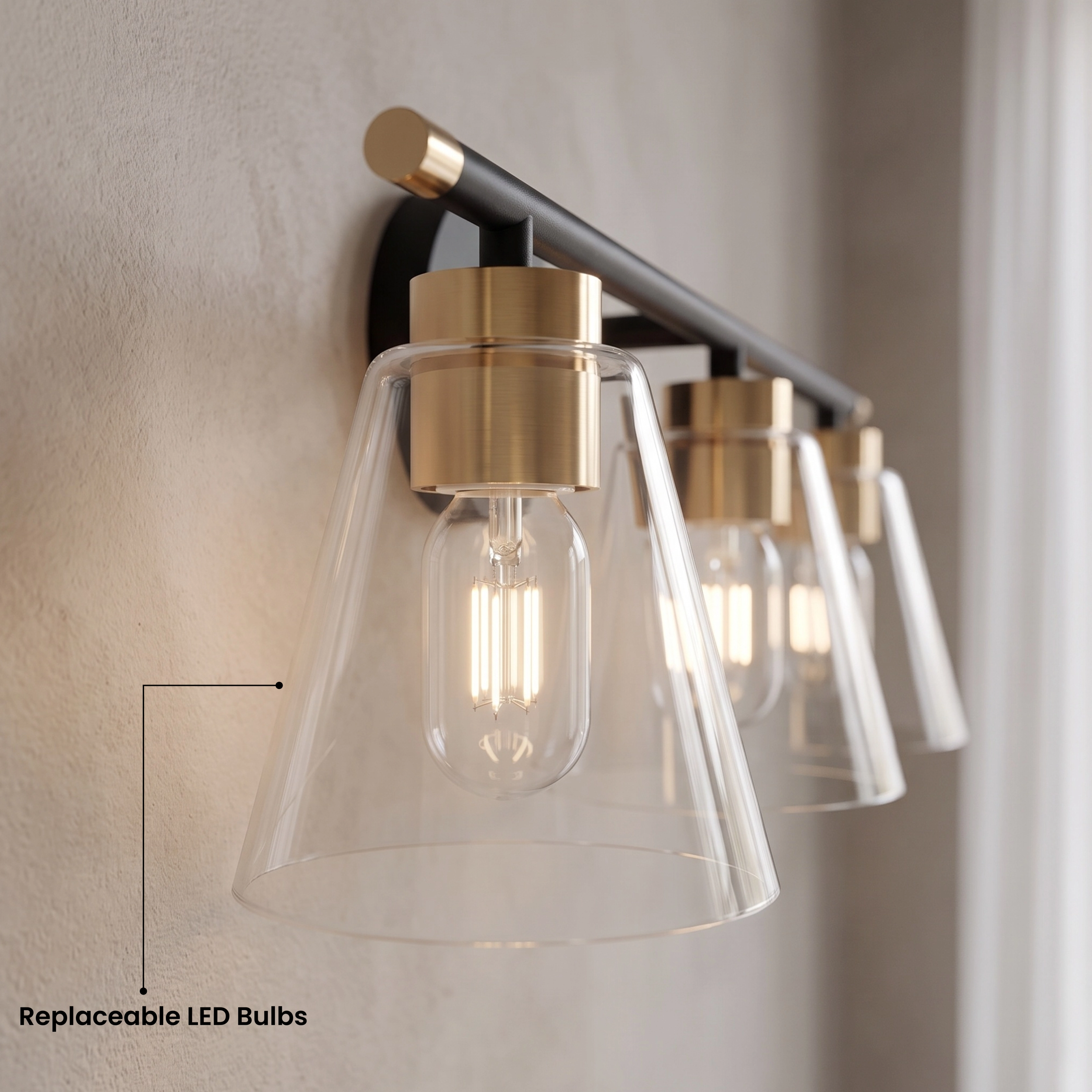 Sienna three-light vanity light shown in warm white 3000K over two mirrors on a marble wall