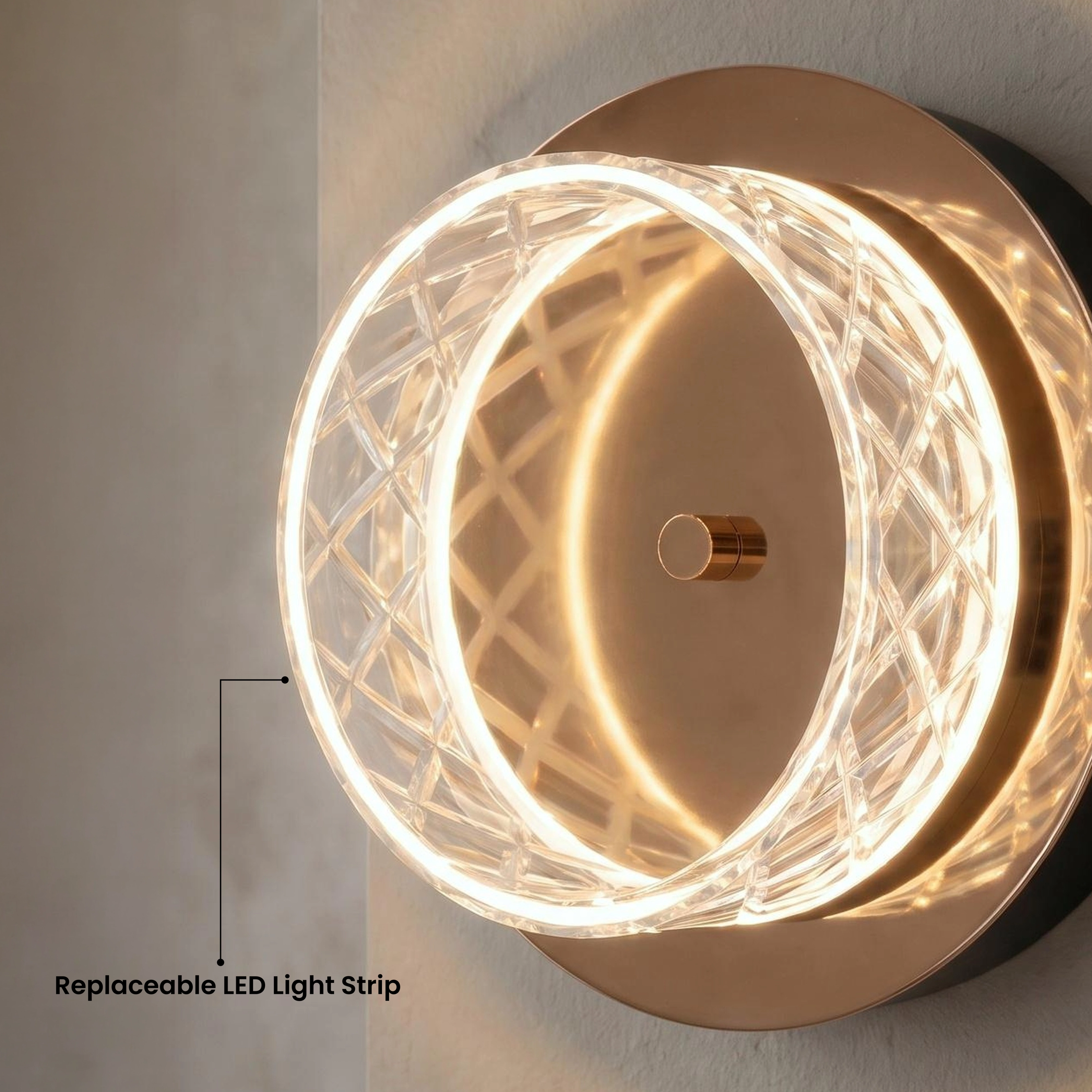 Emma round wall sconce, gold and pearl-black crystal ring in warm white 3000K, glowing above a console table