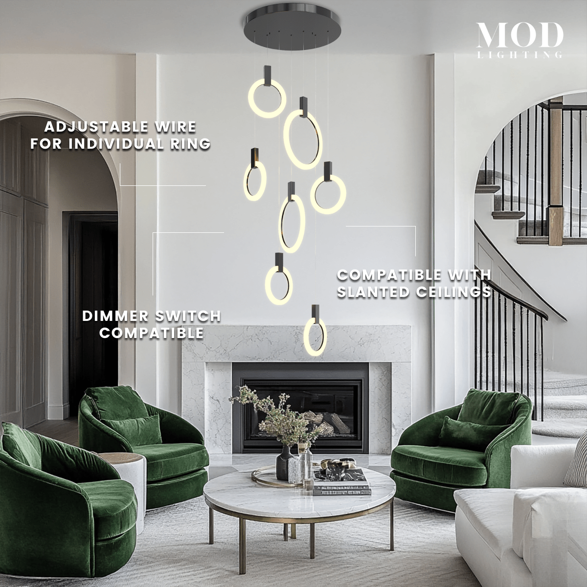 Skyla chandelier, cascading lit rings on black mounts, over a living room with green velvet chairs