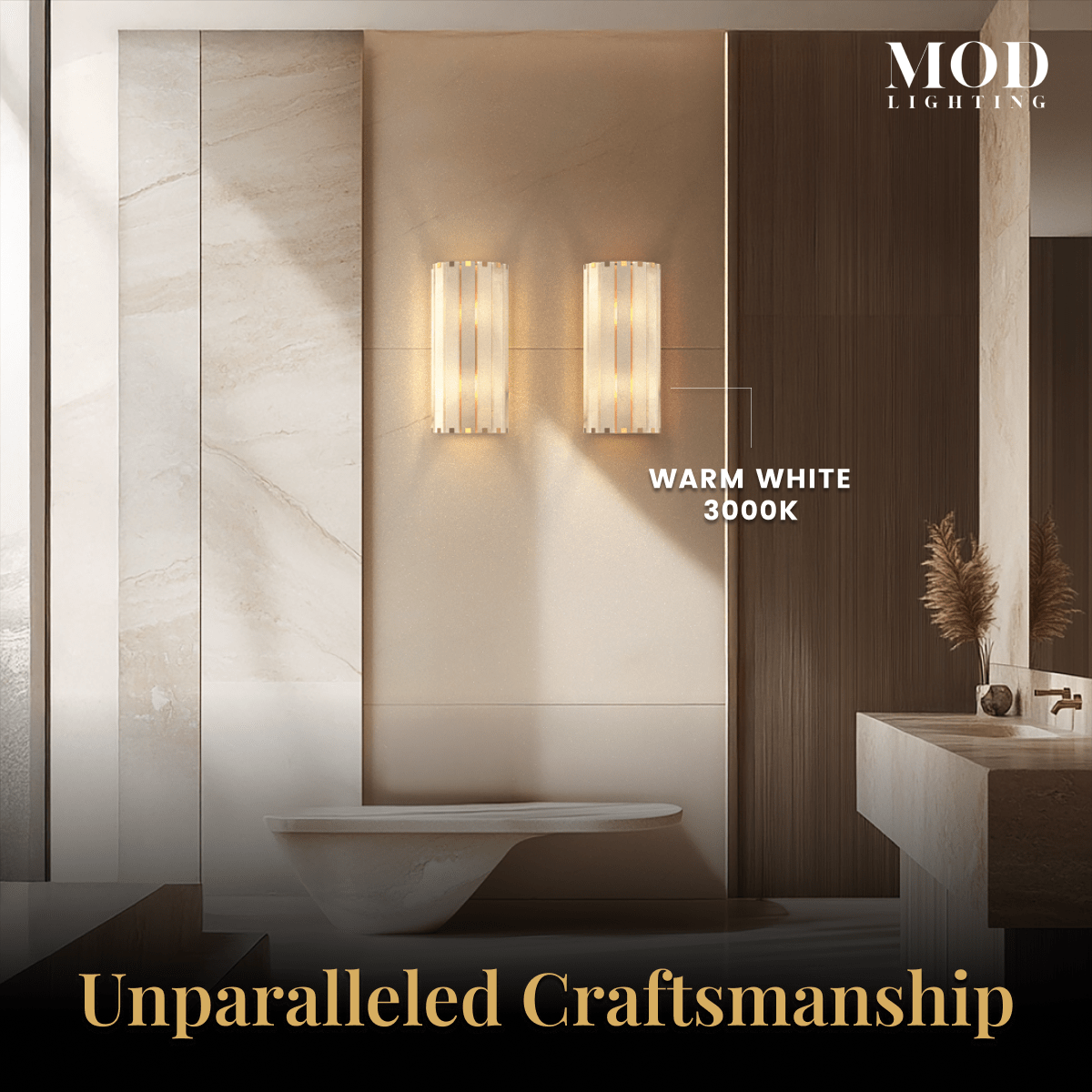 Nala alabaster wall sconce lit warm white 3000K on a wall above a freestanding tub in a bathroom