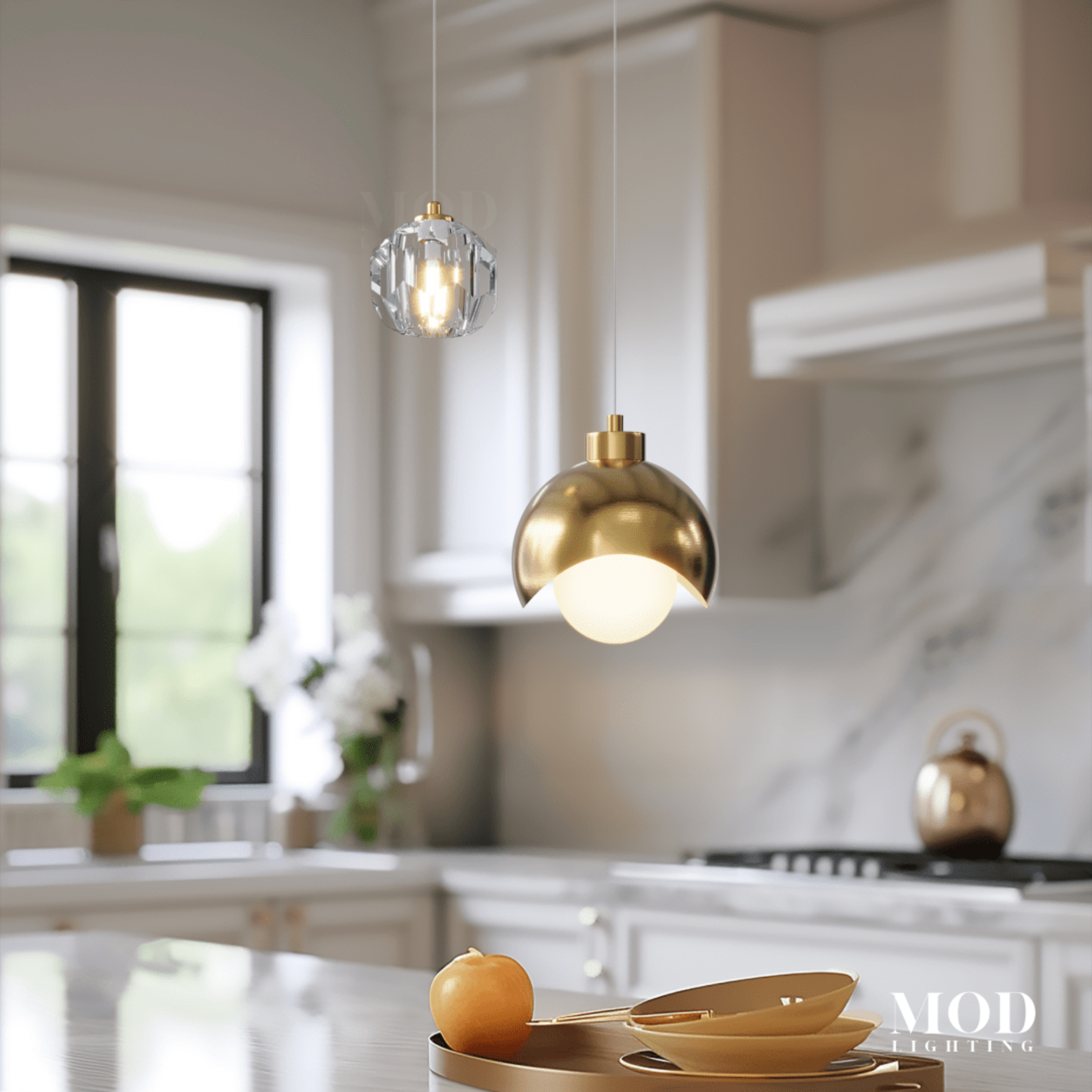 Diana gold globe pendant with faceted crystal accent light in a bright marble kitchen