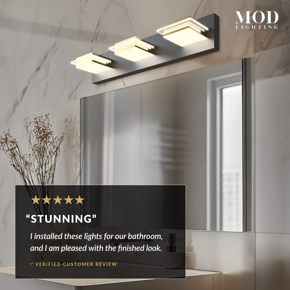 Willow three-light black-and-gold cube vanity light over a mirror, with a five-star Stunning customer review