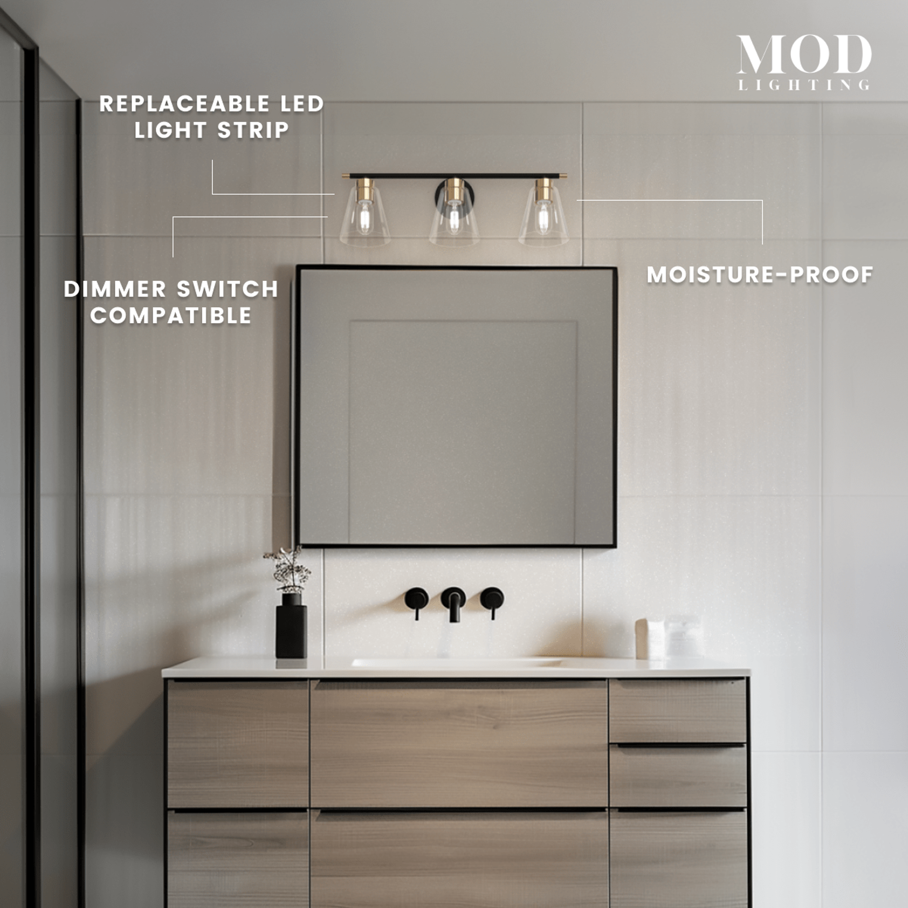 Sienna three-light black-and-gold vanity light over a mirror, with replaceable LED strip and dimmer-compatible