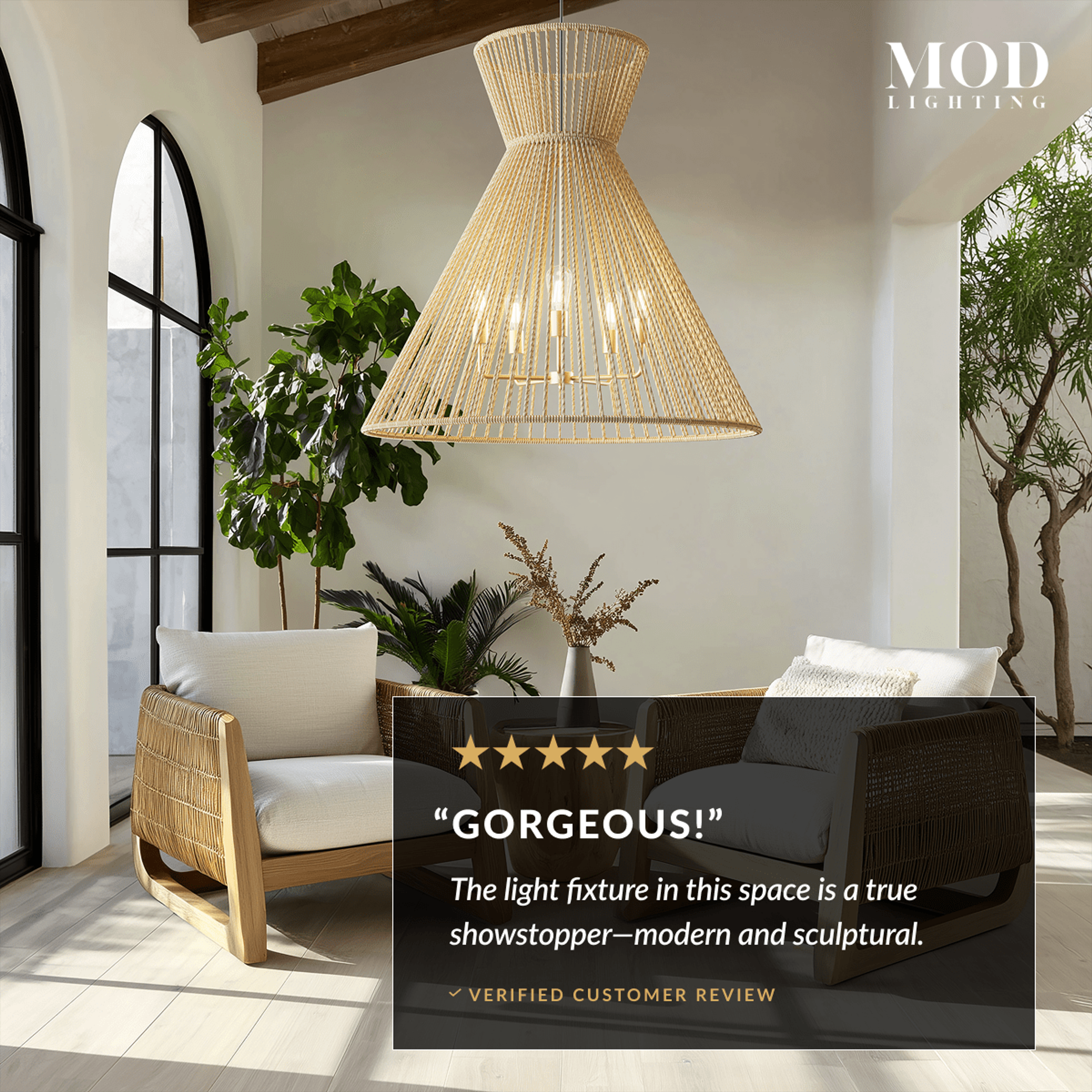 Isla hemp rope pendant, flared hourglass cone form, over armchairs in a sunlit arched room