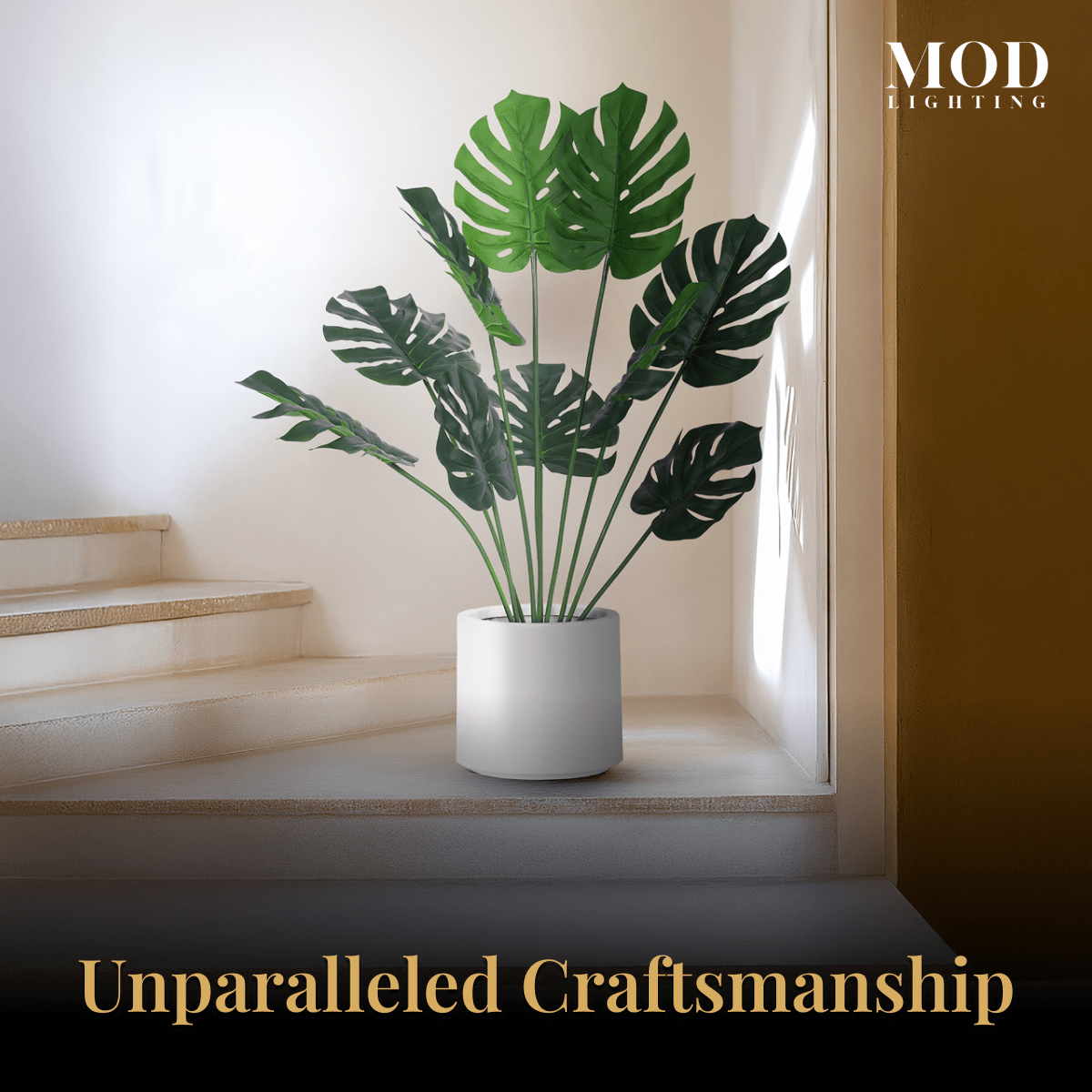 Monstera in a white pot on a sunlit windowsill above a staircase in a warm, minimal room