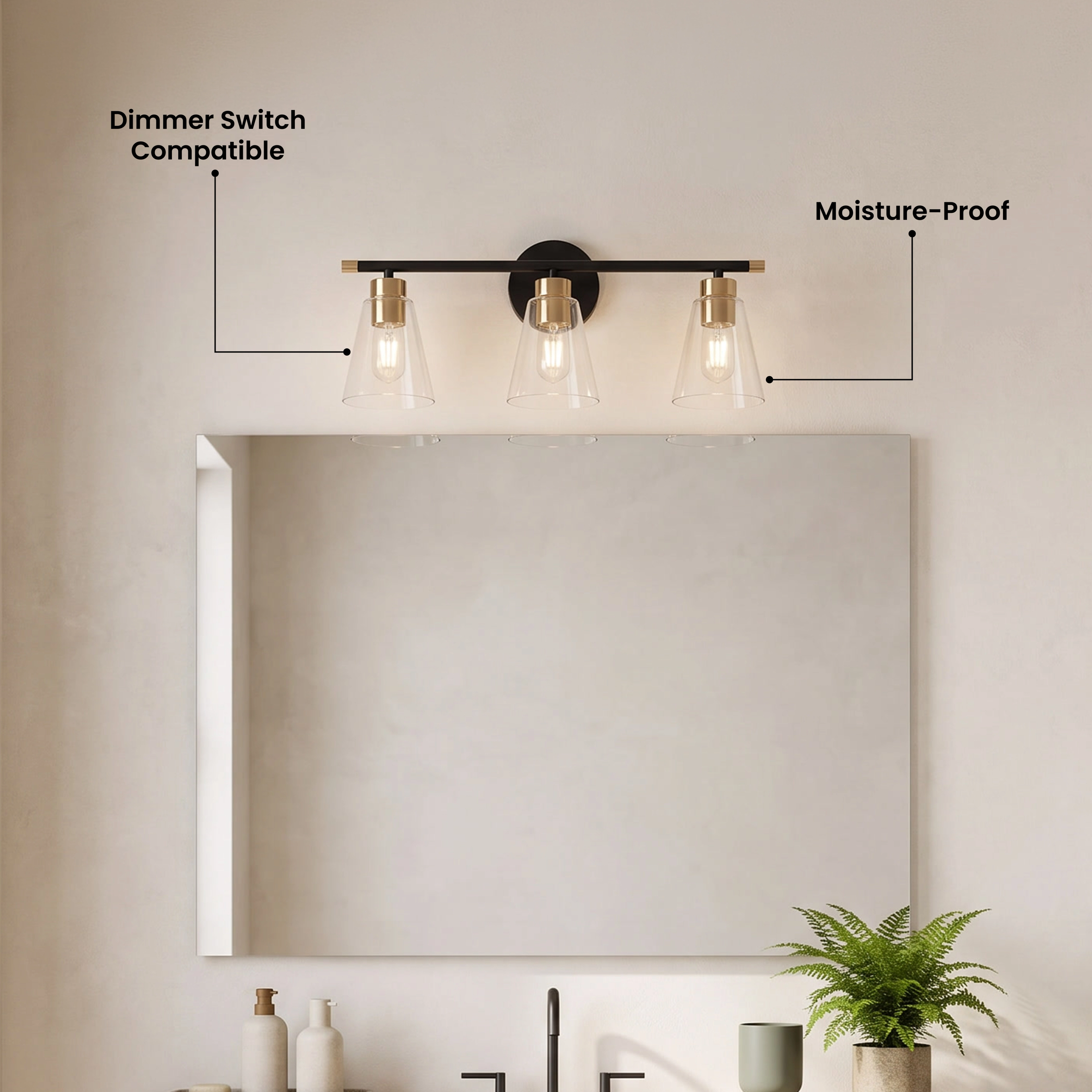 Sienna three-light black-and-gold vanity light over a mirror, with replaceable LED strip and dimmer-compatible