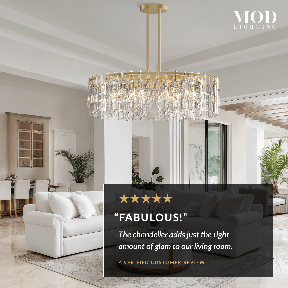Radiance brushed-gold drum chandelier with layered clear crystal rods over a living room seating area