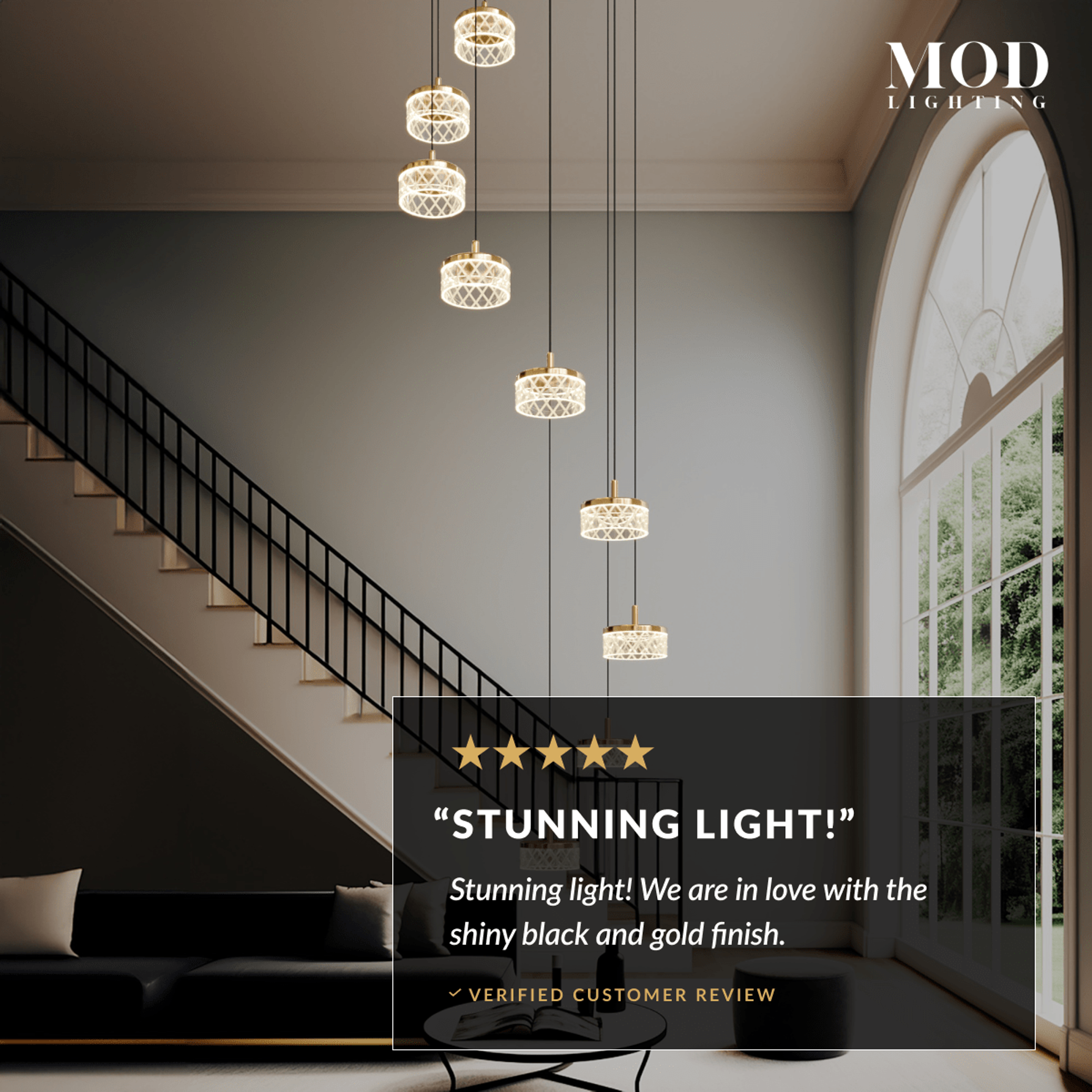 Emma staircase chandelier, spiral of gold and pearl-black crystal drum pendants beside a staircase, with review overlay