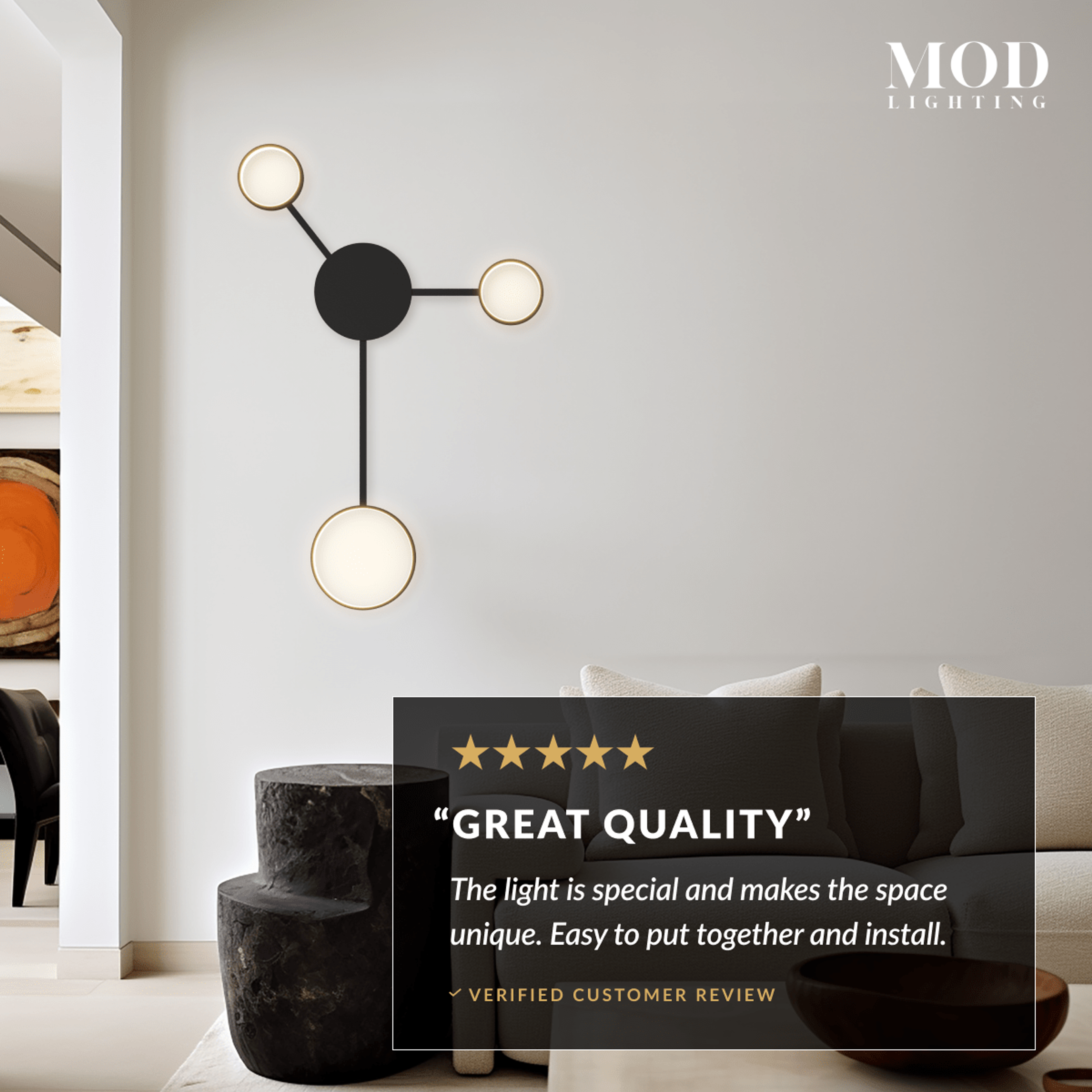 Link wall light, black arms and gold discs, warm white, mounted above a bed headboard