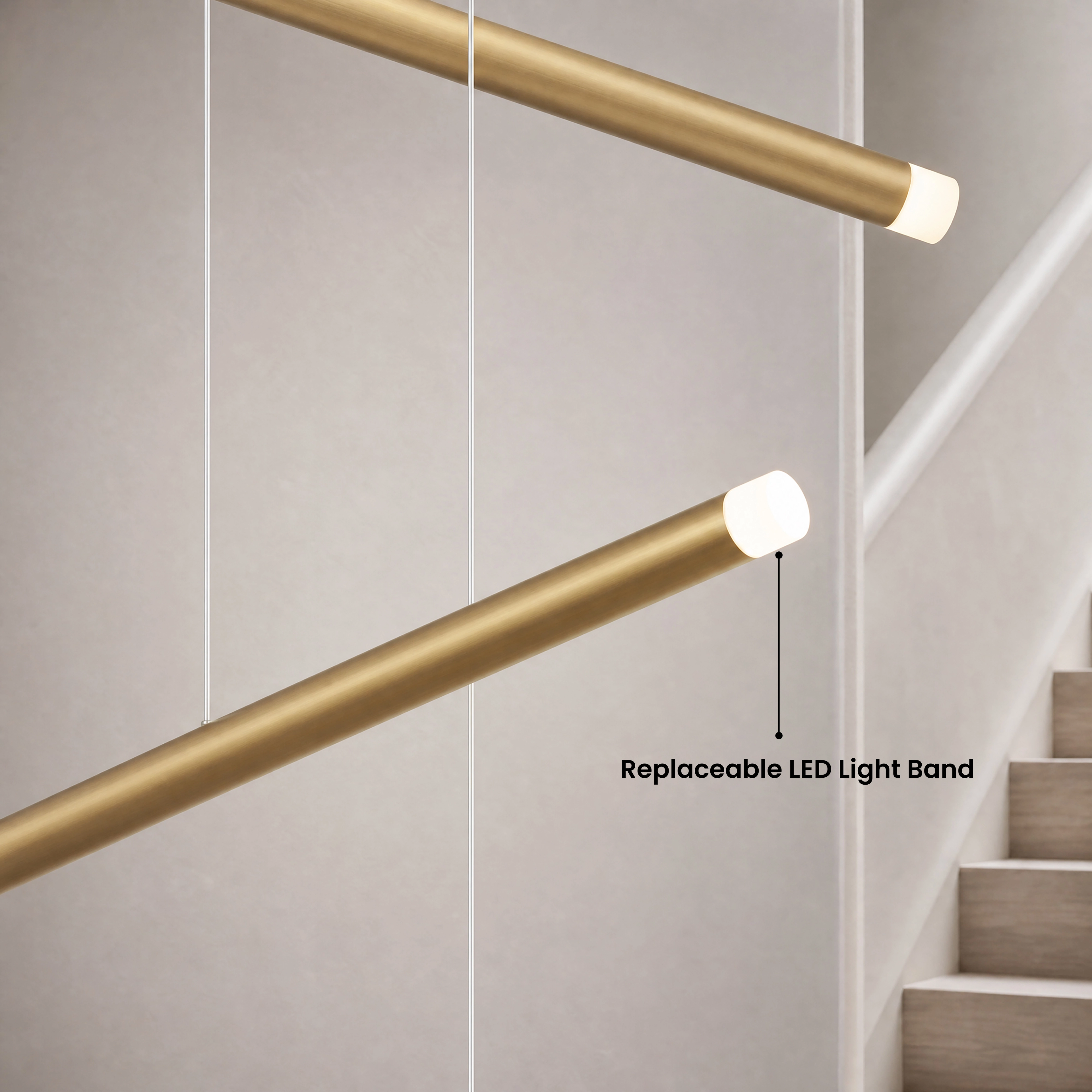 Freya gold cascading light-bar chandelier in warm white 3000K over a sofa, available in four sizes