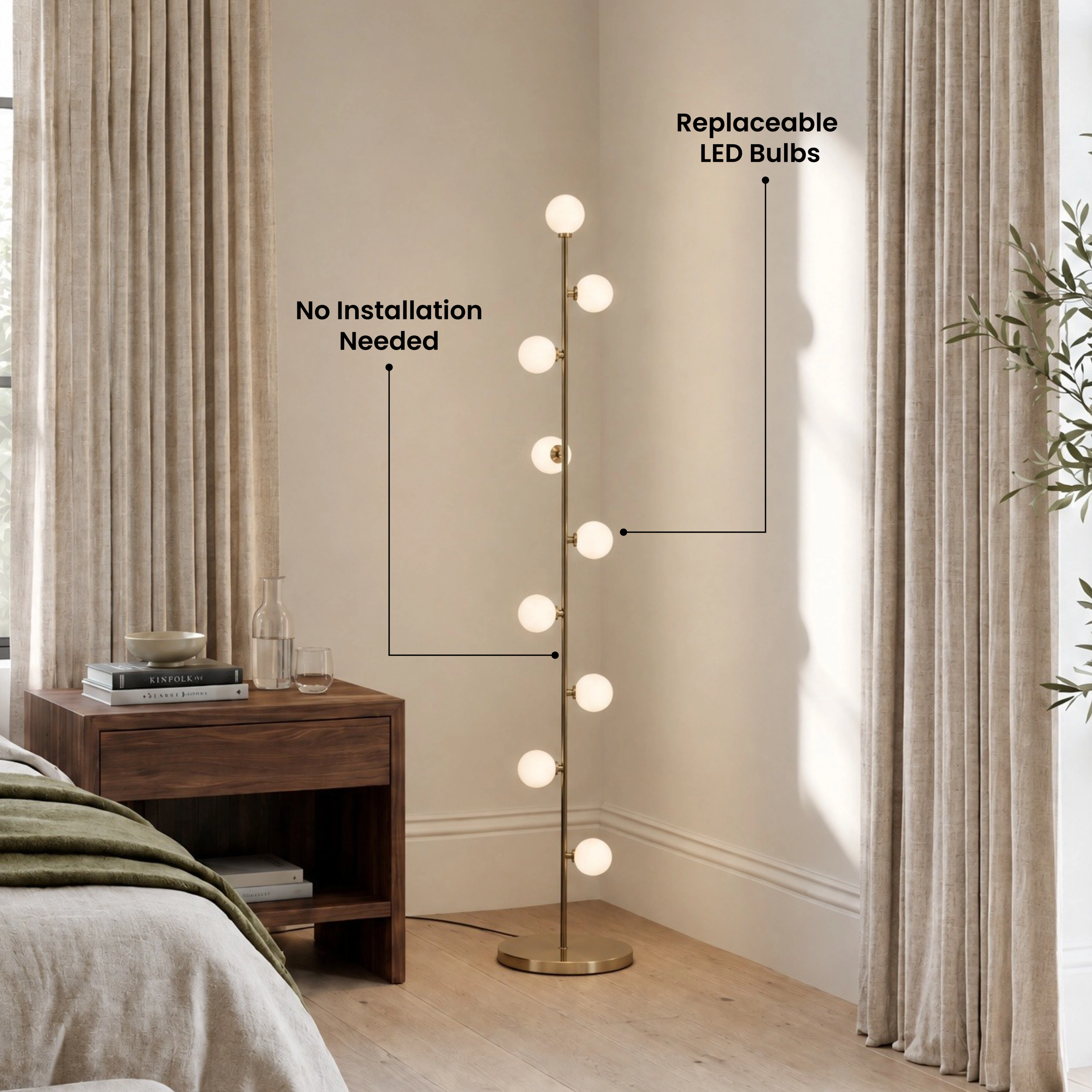 Pearl floor lamp lit in a dark living room, gold stem with glowing frosted glass globes beside a sofa