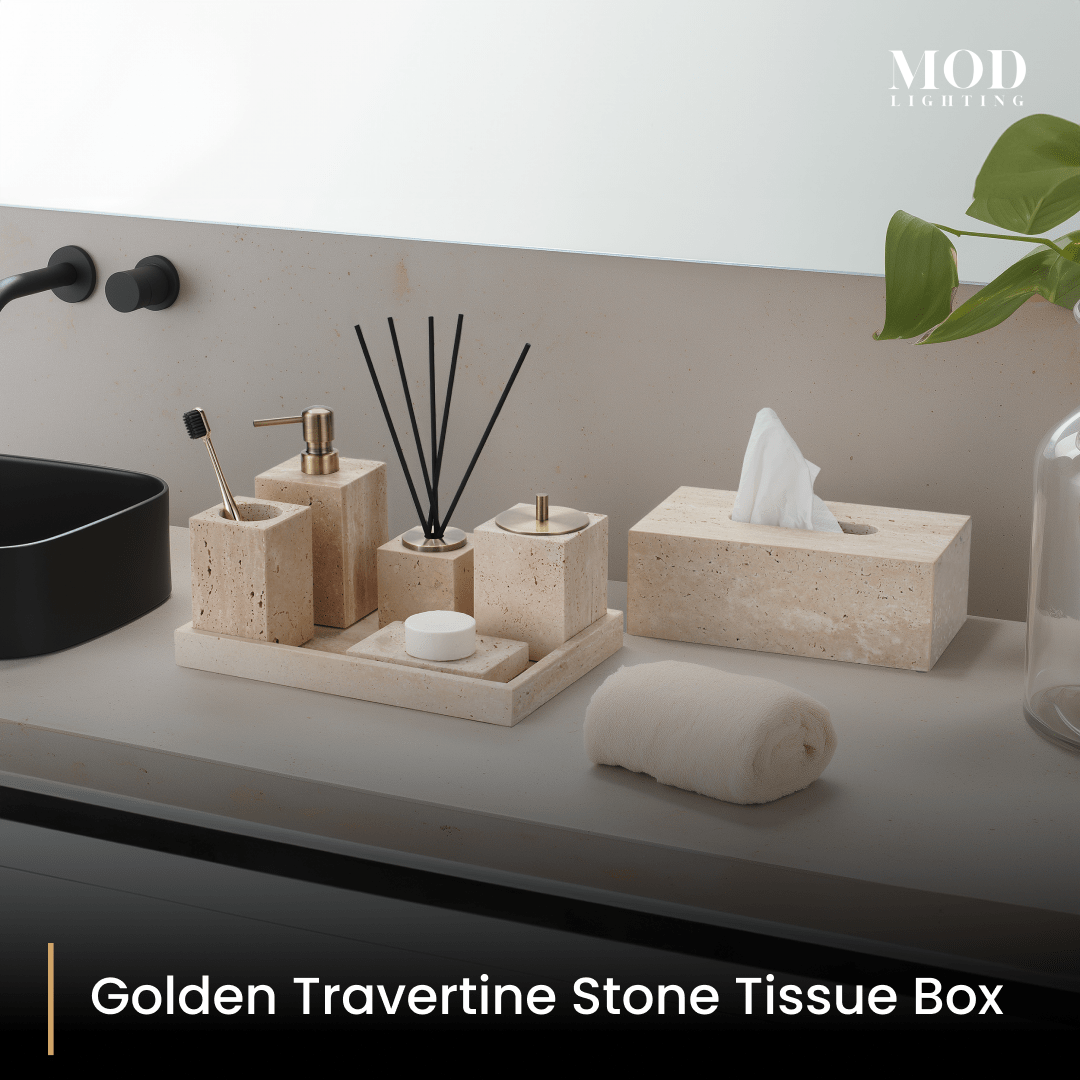 Golden Travertine tissue box and bath set on a tray on a grey vanity with black tap and plant