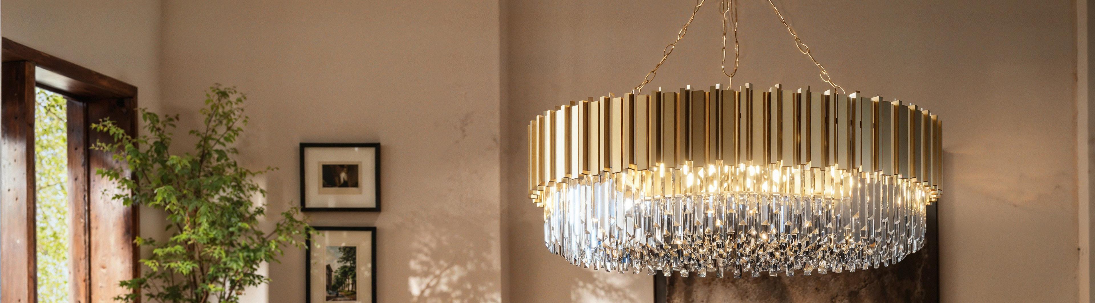 A MOD LIGHTING crystal chandelier over a living room sofa