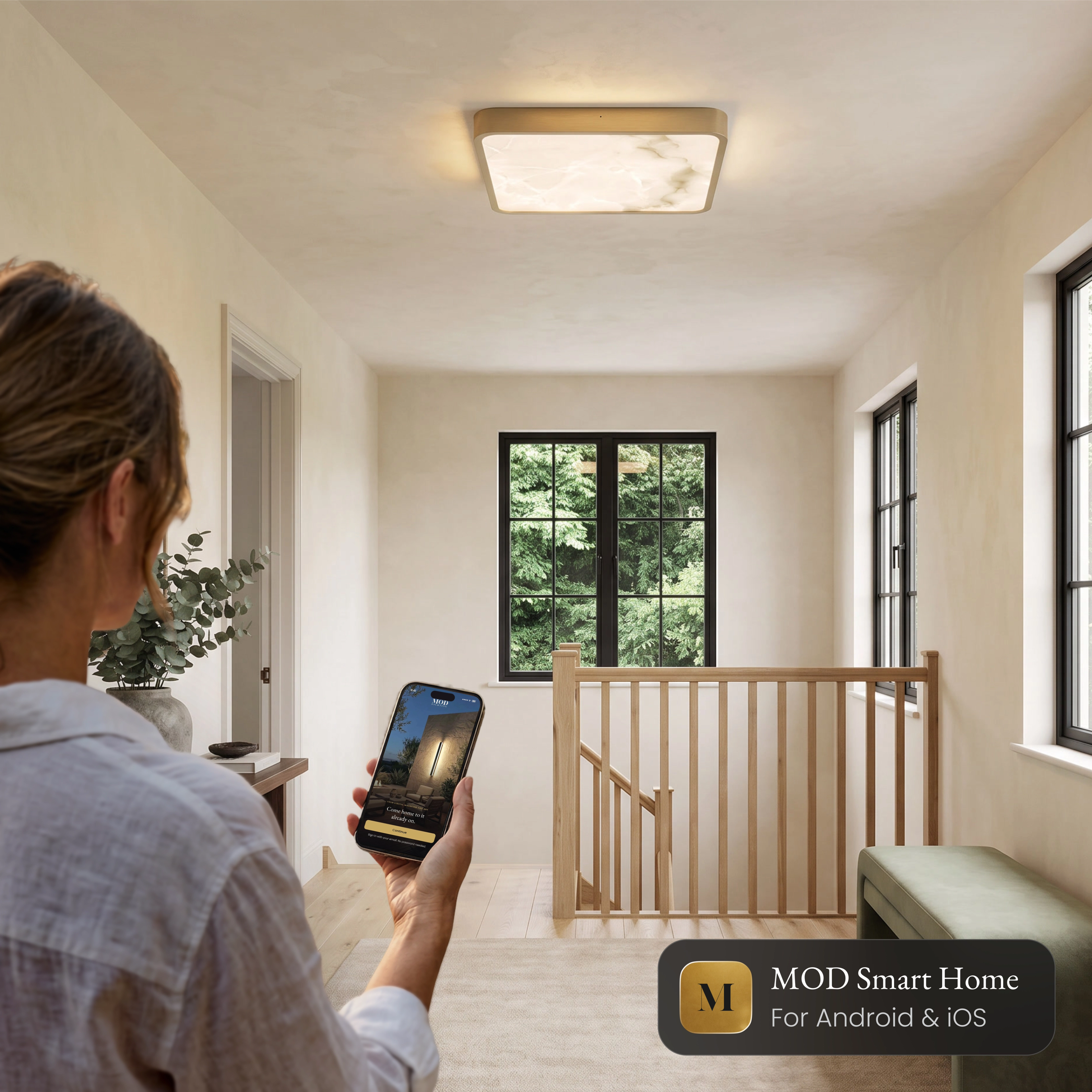Selene Smart square alabaster ceiling light on a landing, controlled from the MOD Smart Home app on a phone