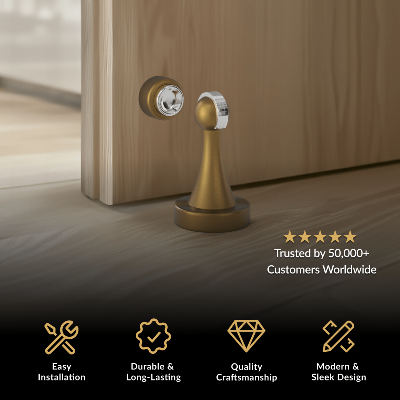 Noka Door Stop, brushed gold magnetic floor stop with domed catch beside a wood door
