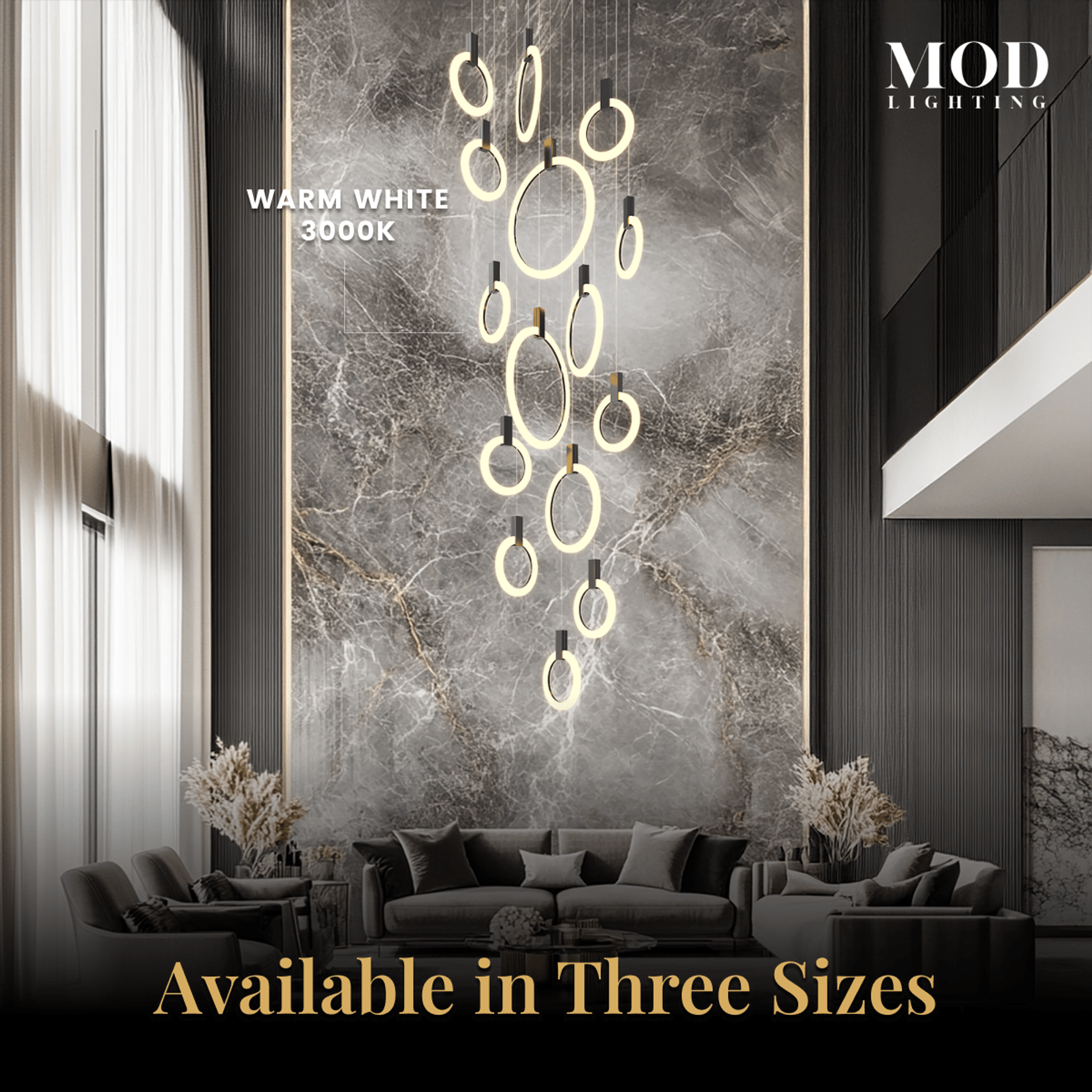 Skyla chandelier, warm white 3000K lit rings cascading against a marble feature wall over a sofa