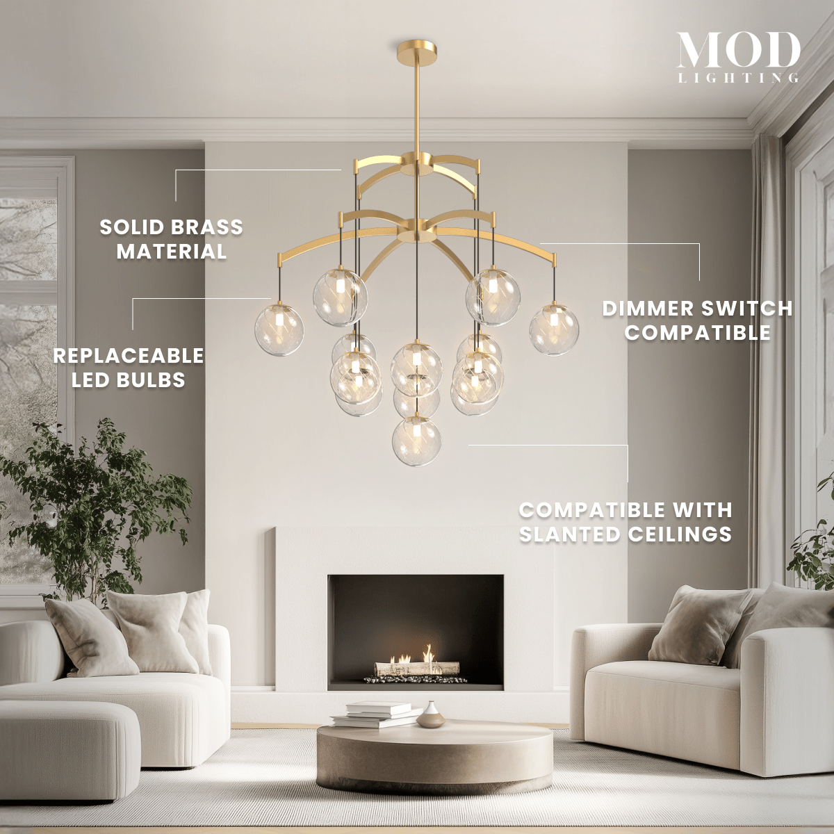 Mirella brushed-gold chandelier with amber glass globes over a living room; notes solid brass and replaceable LED bulbs