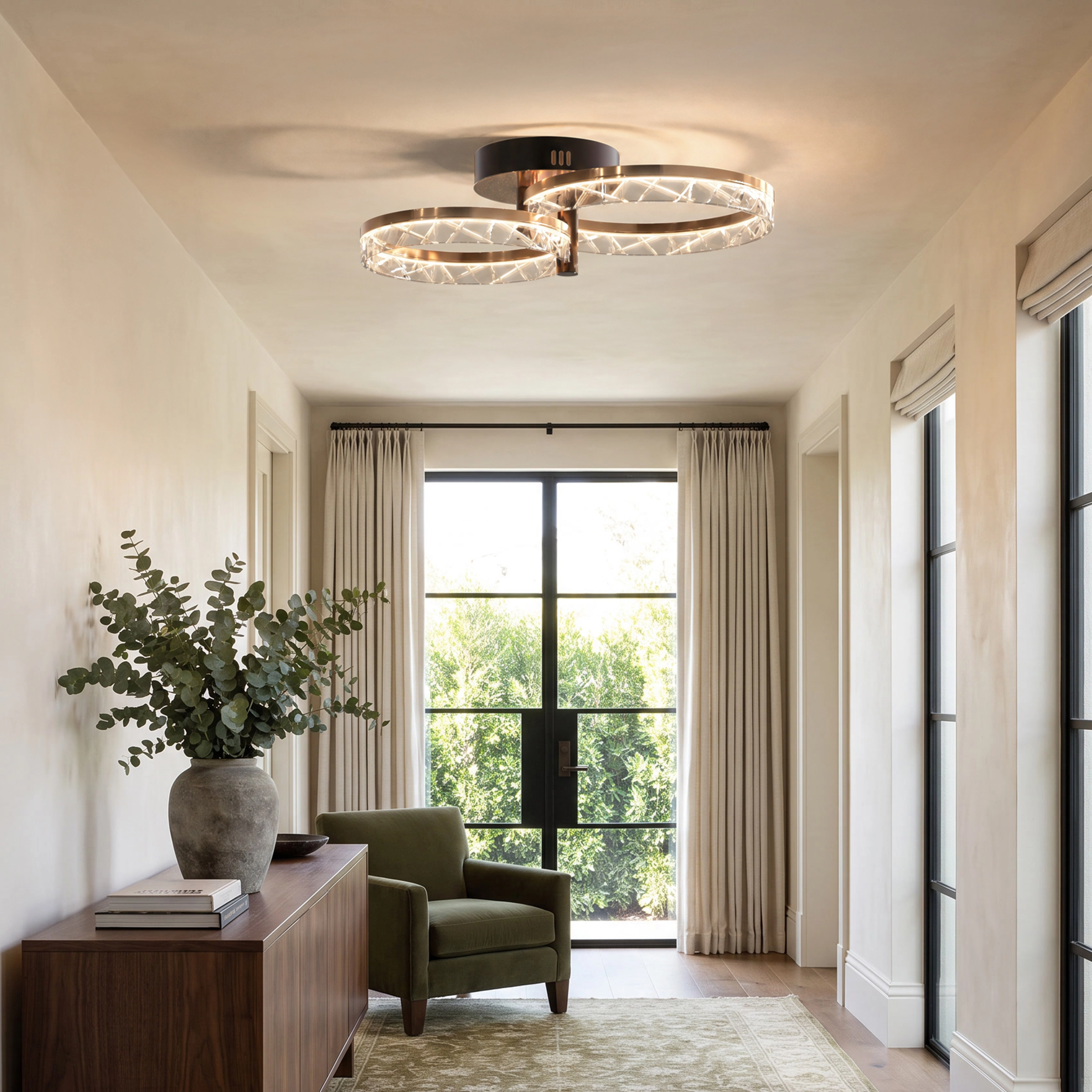 Clara Smart gold crystal ceiling light with 2 rings in a bright sitting room