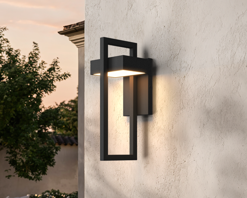 Terri, a black frame wall sconce, on a limestone facade