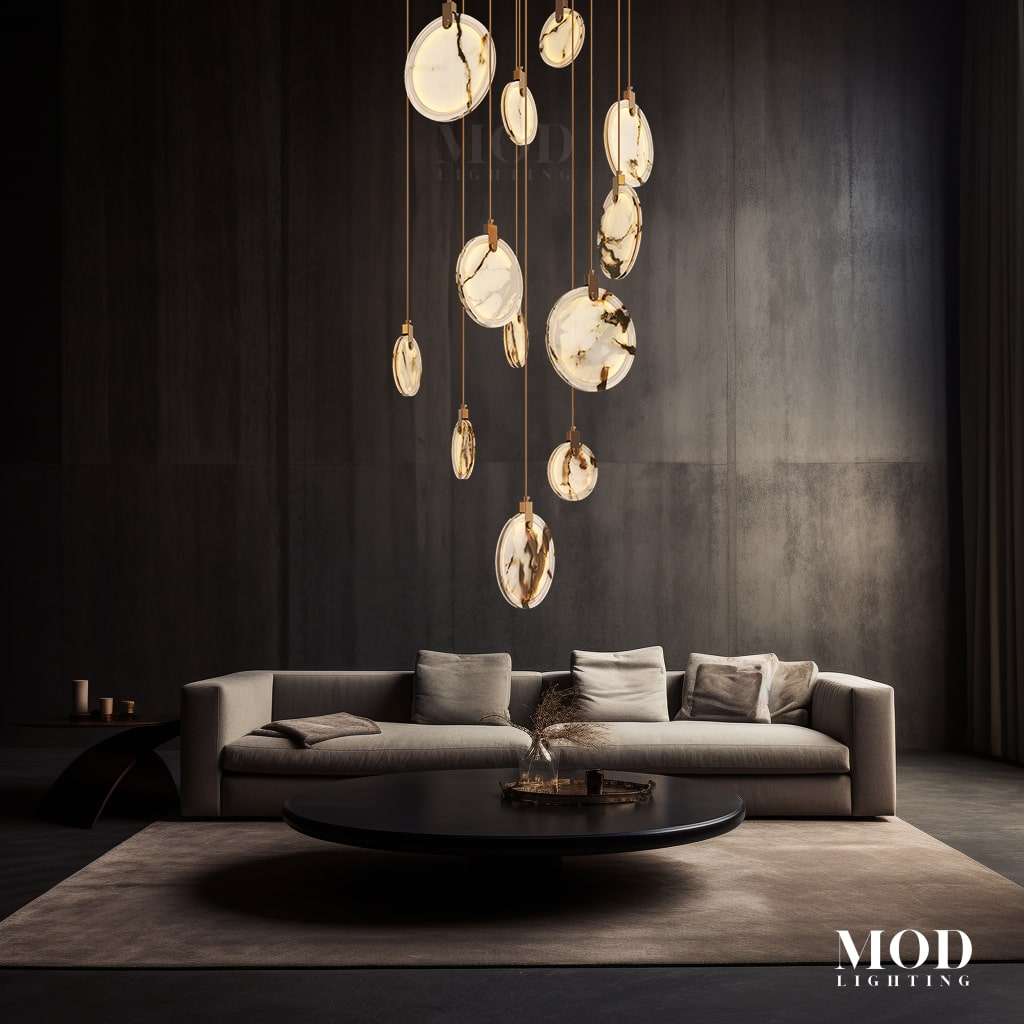 Marble gold-veined alabaster disc pendant cluster suspended over a sofa and coffee table in a dark modern living room
