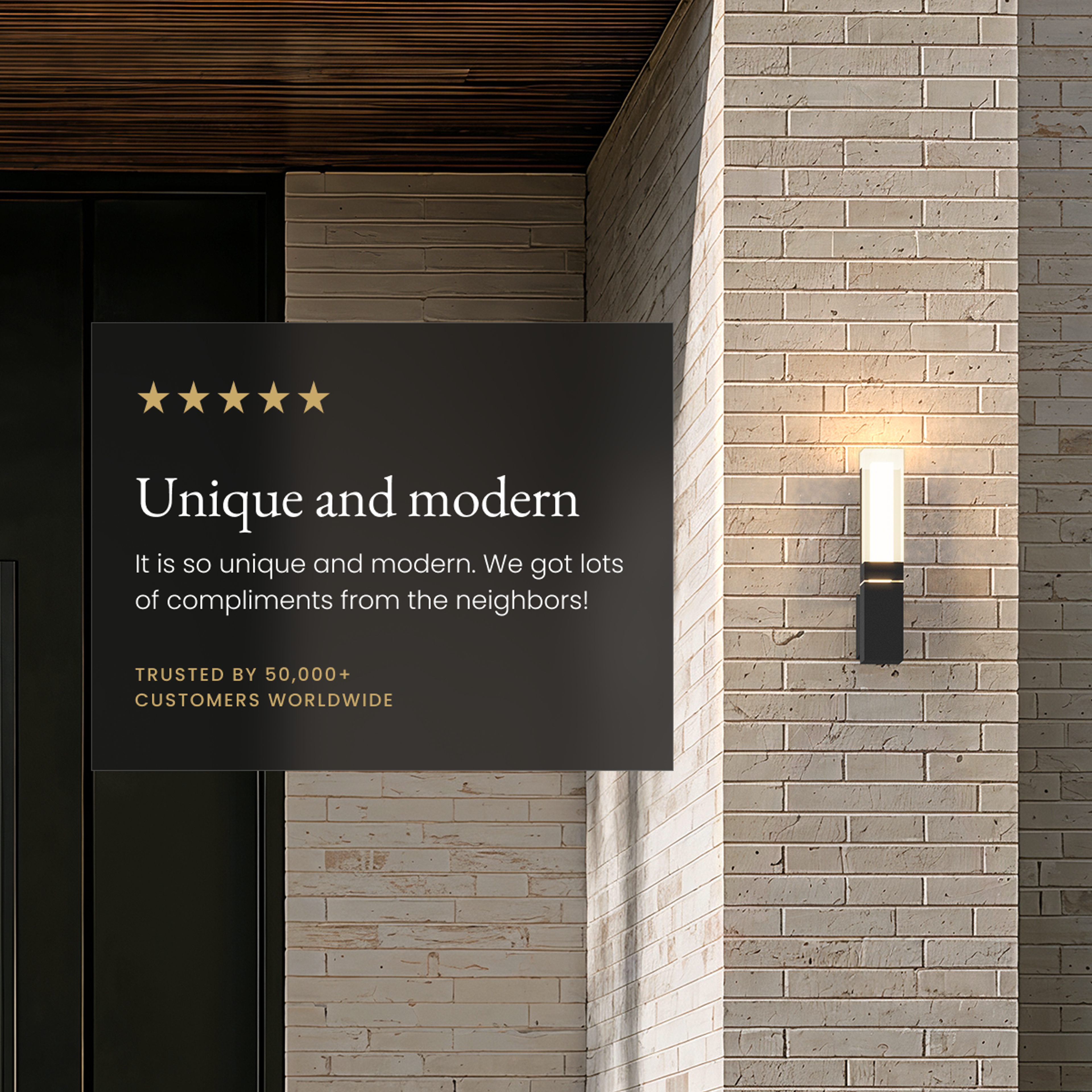 Falcon black outdoor sconce on a brick wall beside a five-star customer review card