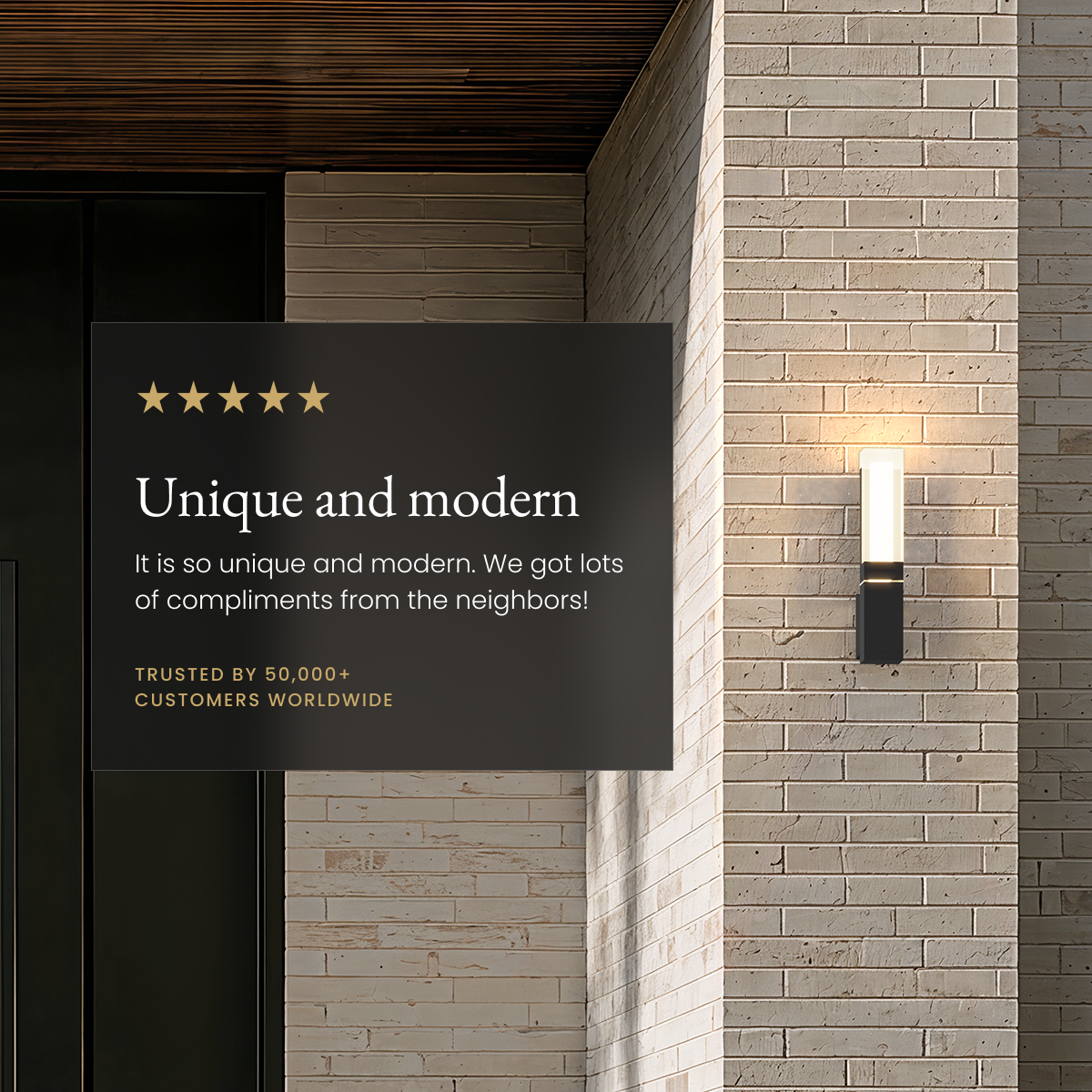 Falcon black outdoor sconce on a brick wall beside a five-star customer review card