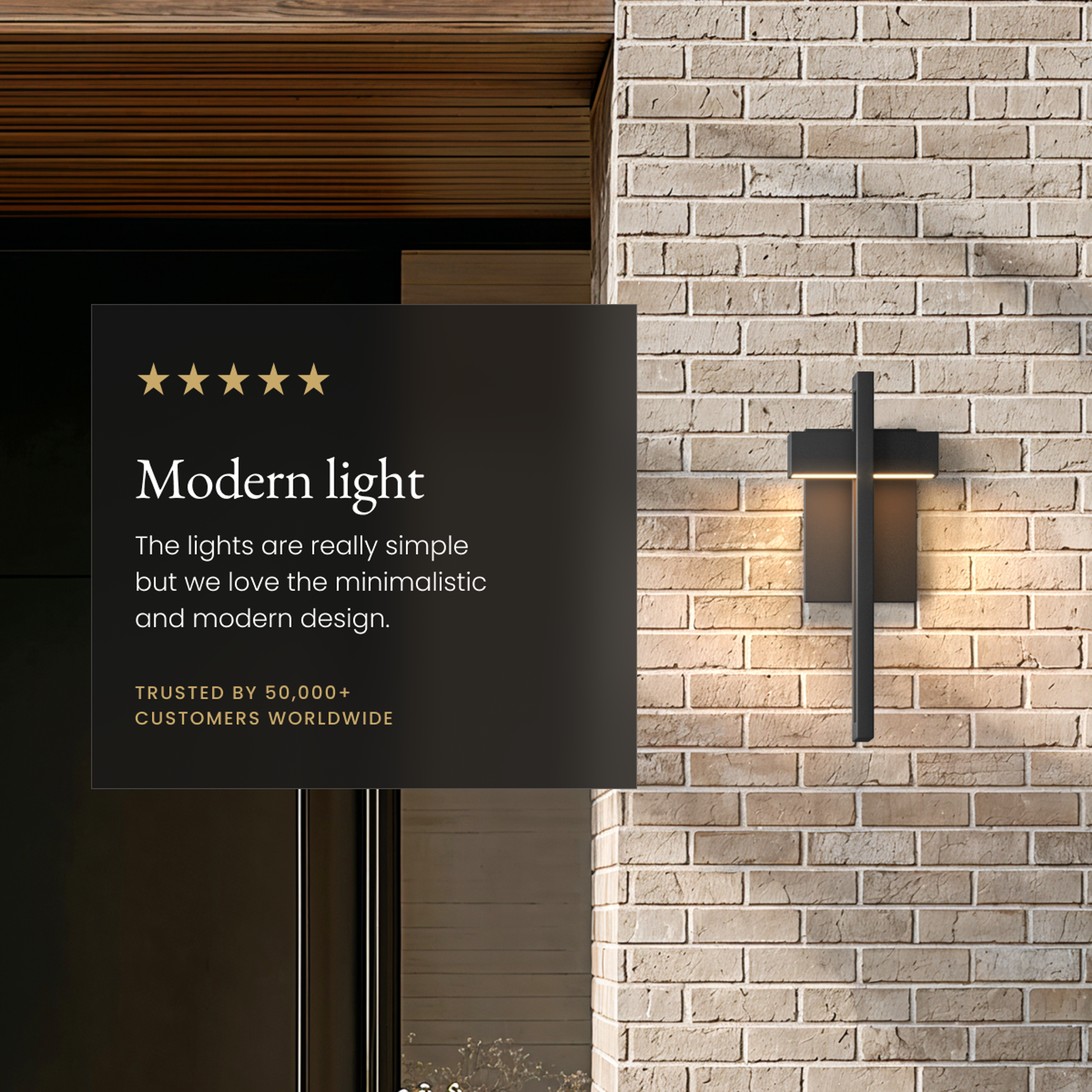 Terri black outdoor sconce on a brick wall, with a five-star customer review overlay