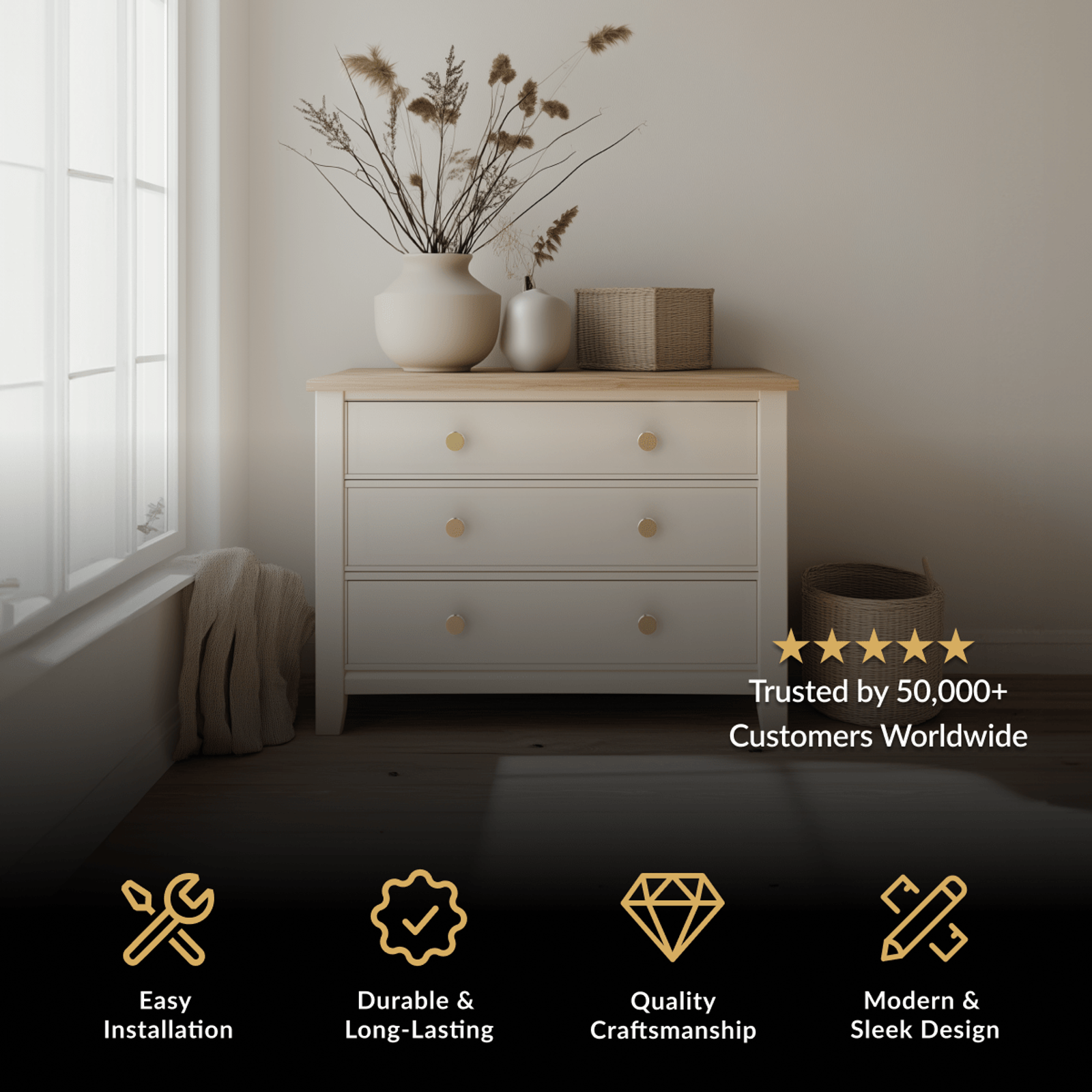 Balmuto Cabinet Knob in brushed gold on a white three-drawer chest by a window