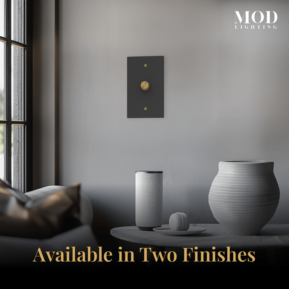 Modern Dimmer Switch, matte black plate with gold rotary knob on a gray wall, available in two finishes