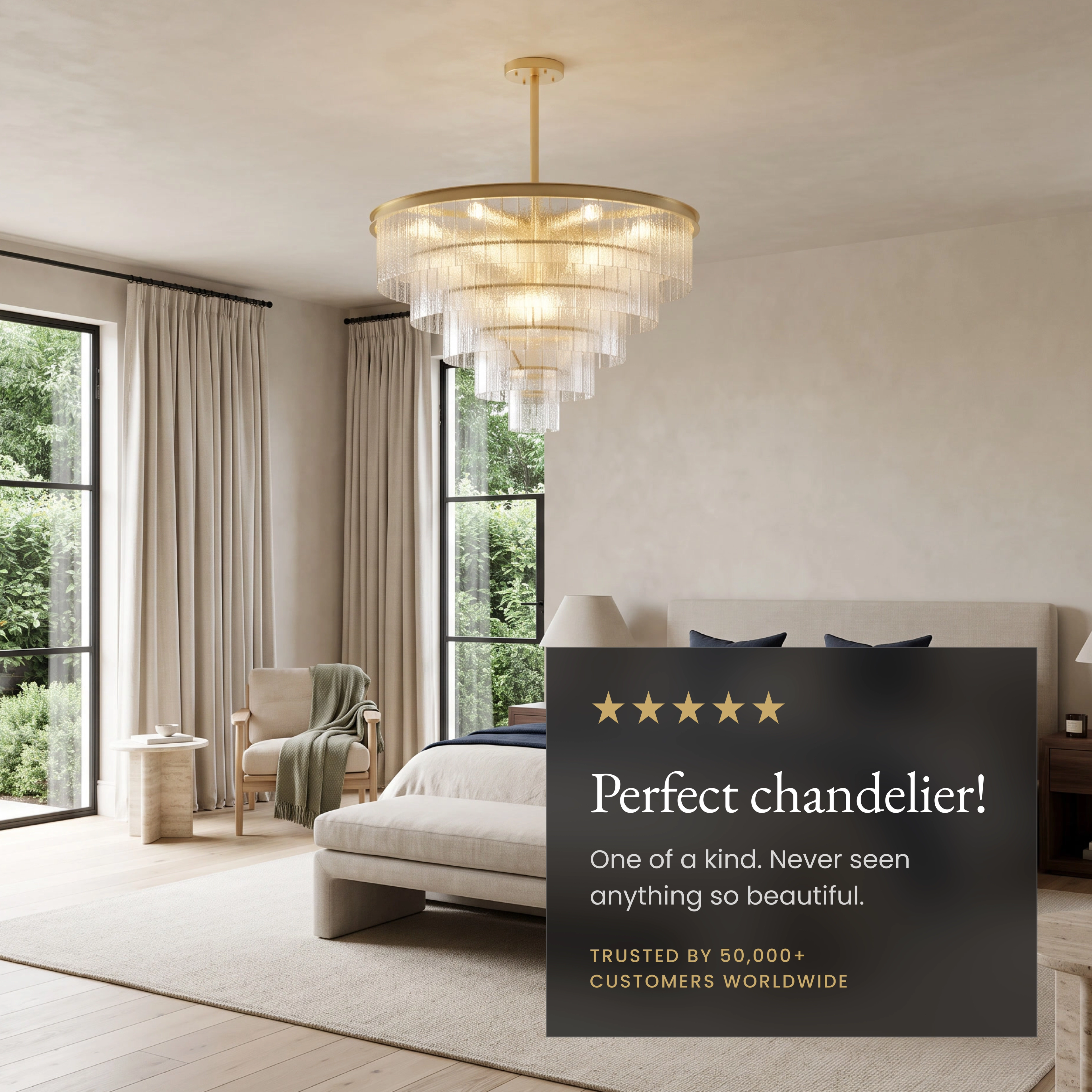 Cascade brass chandelier with tiered textured-glass fringe over a living room, noting adjustable rod and solid brass