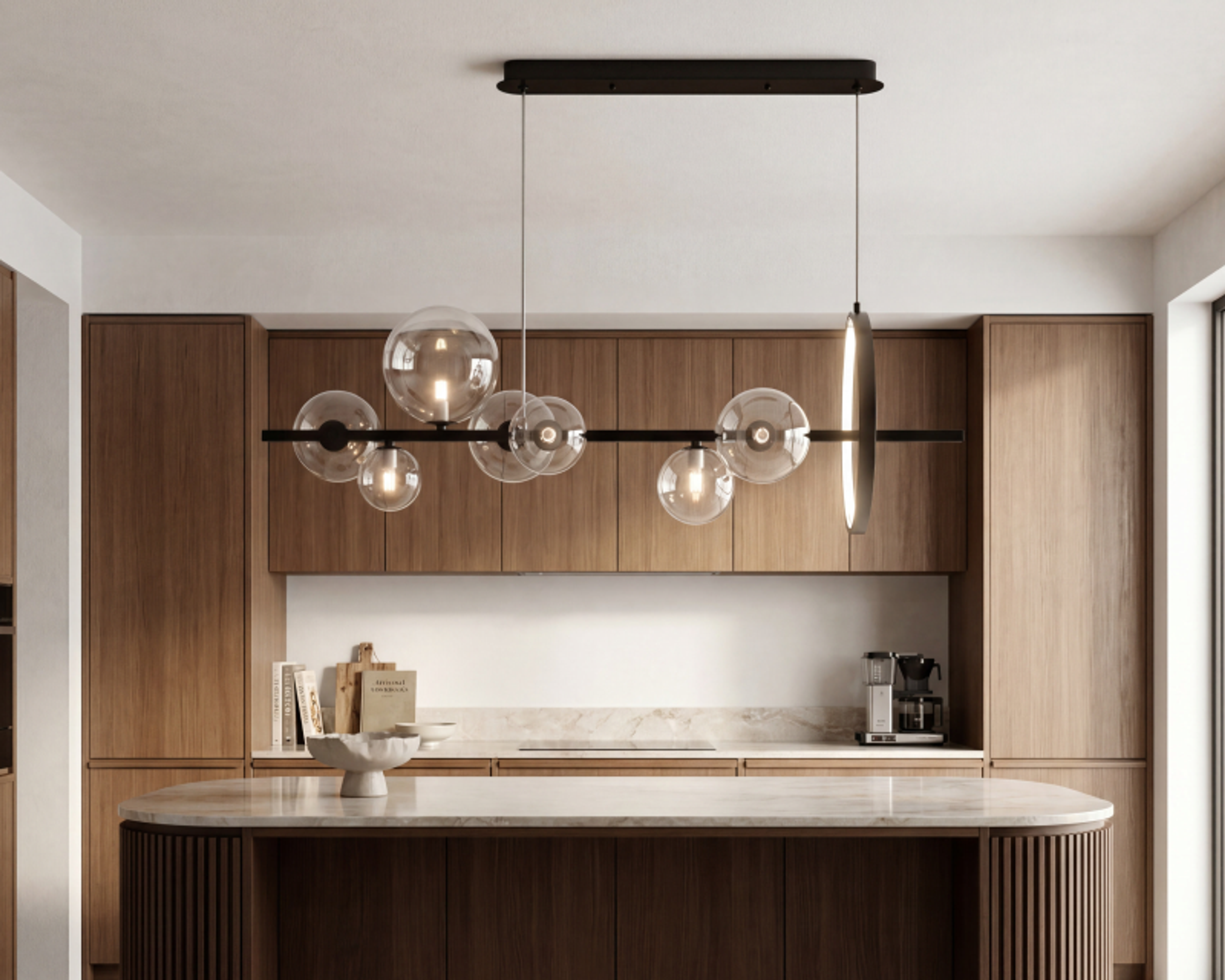 Linear globe pendant above a kitchen island