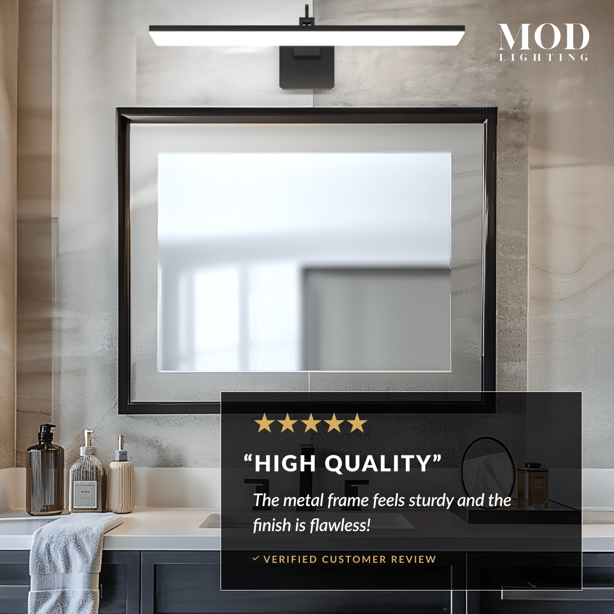 Zena black LED bar vanity light mounted above a framed mirror in a bathroom, close-up of the metal frame