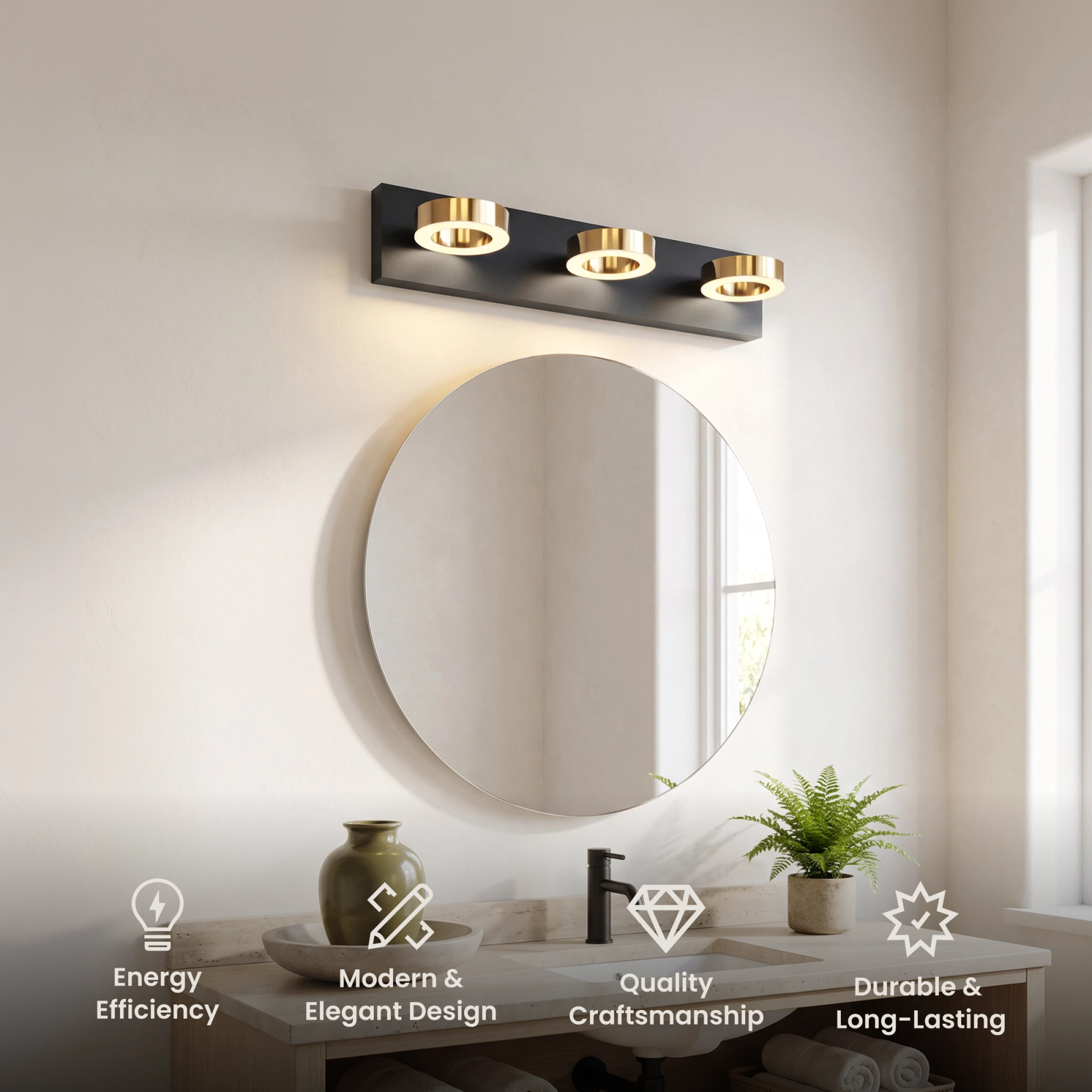 Aurora bathroom light, three circular lights on a matte black bar with gold accents over a black-framed mirror
