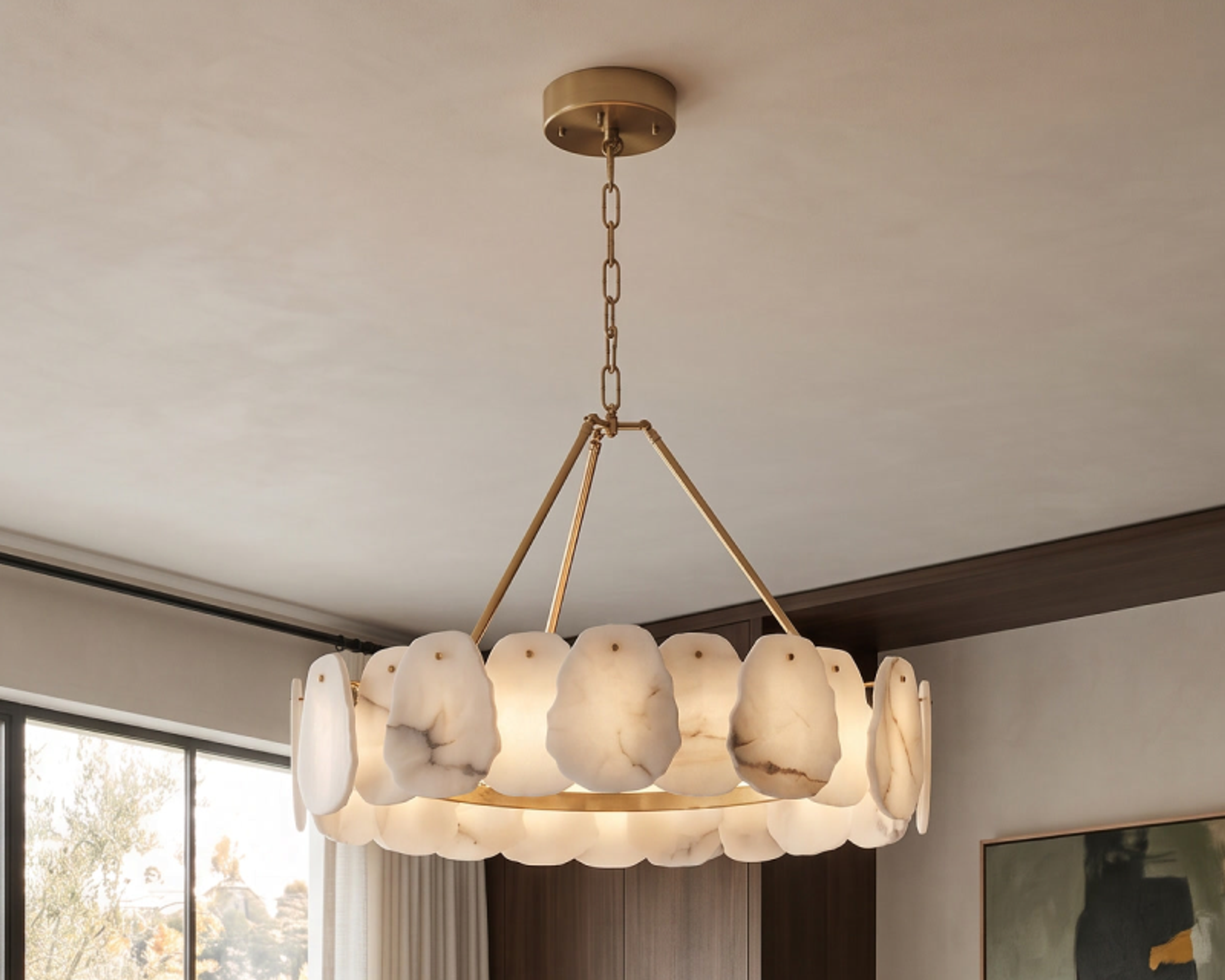 Alba smart chandelier, alabaster discs on brass, lit warm above a dining table