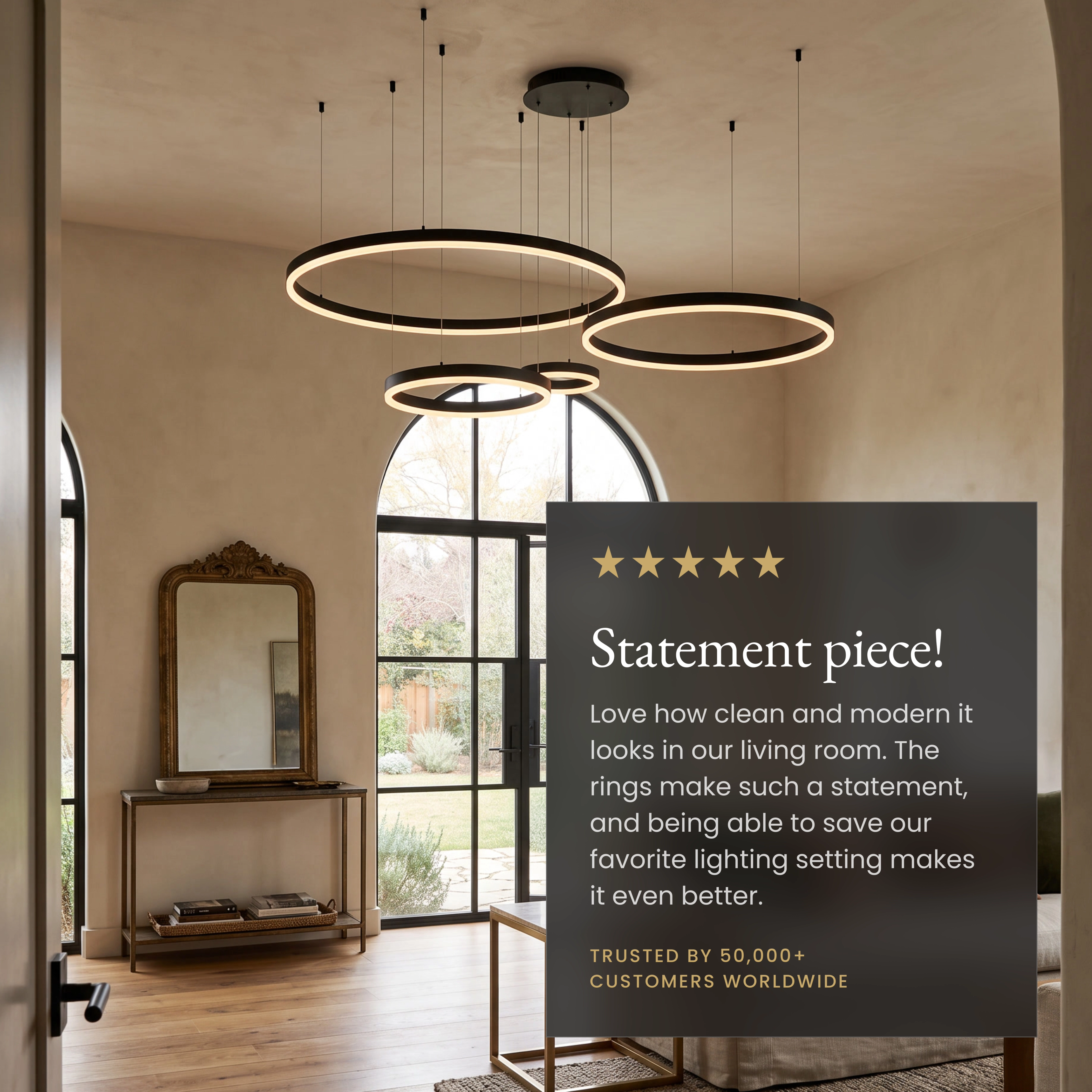 Charlotte Smart black tiered ring chandelier in a living room beside a five-star customer review