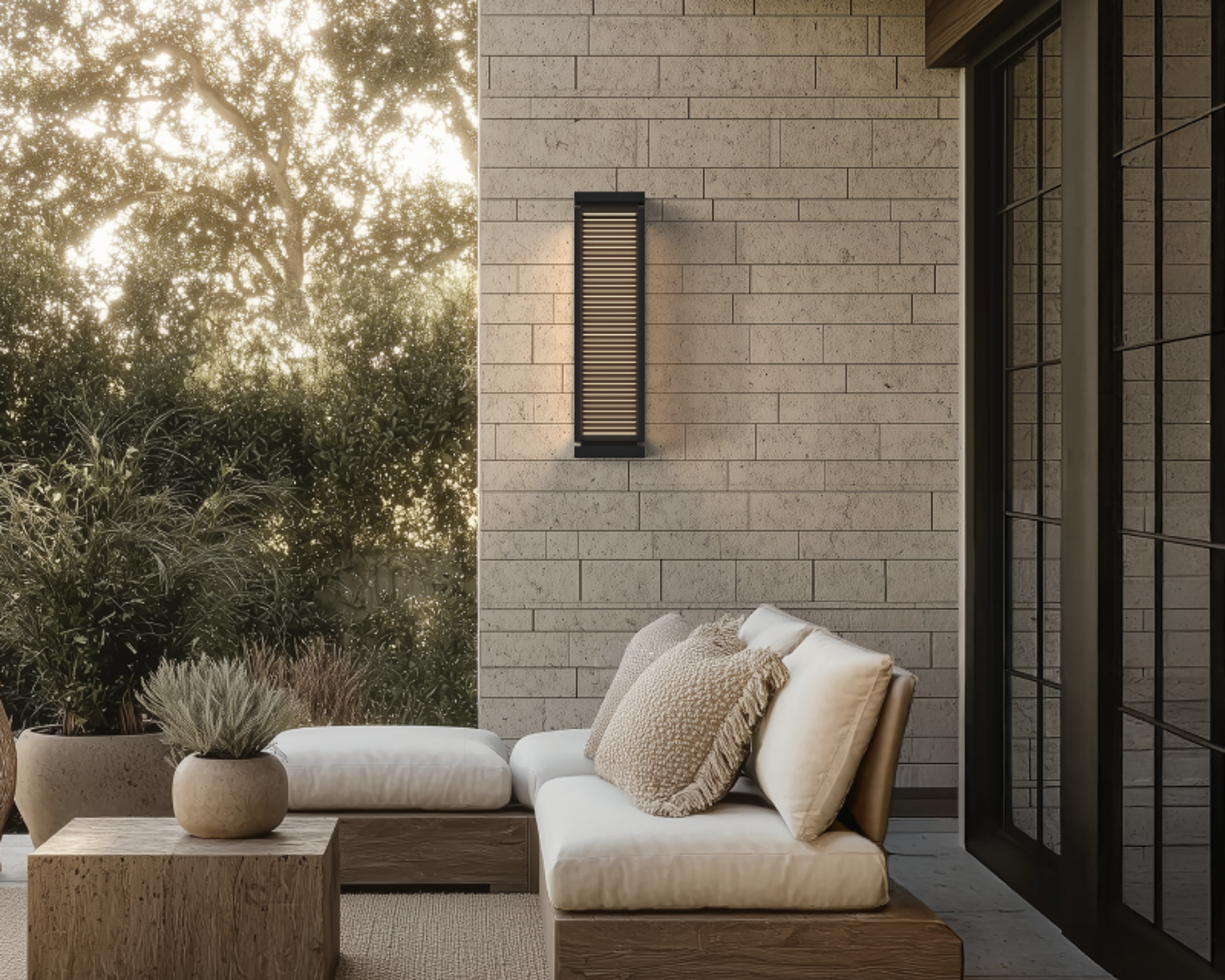 Harper wall lights on a patio wall beside outdoor seating