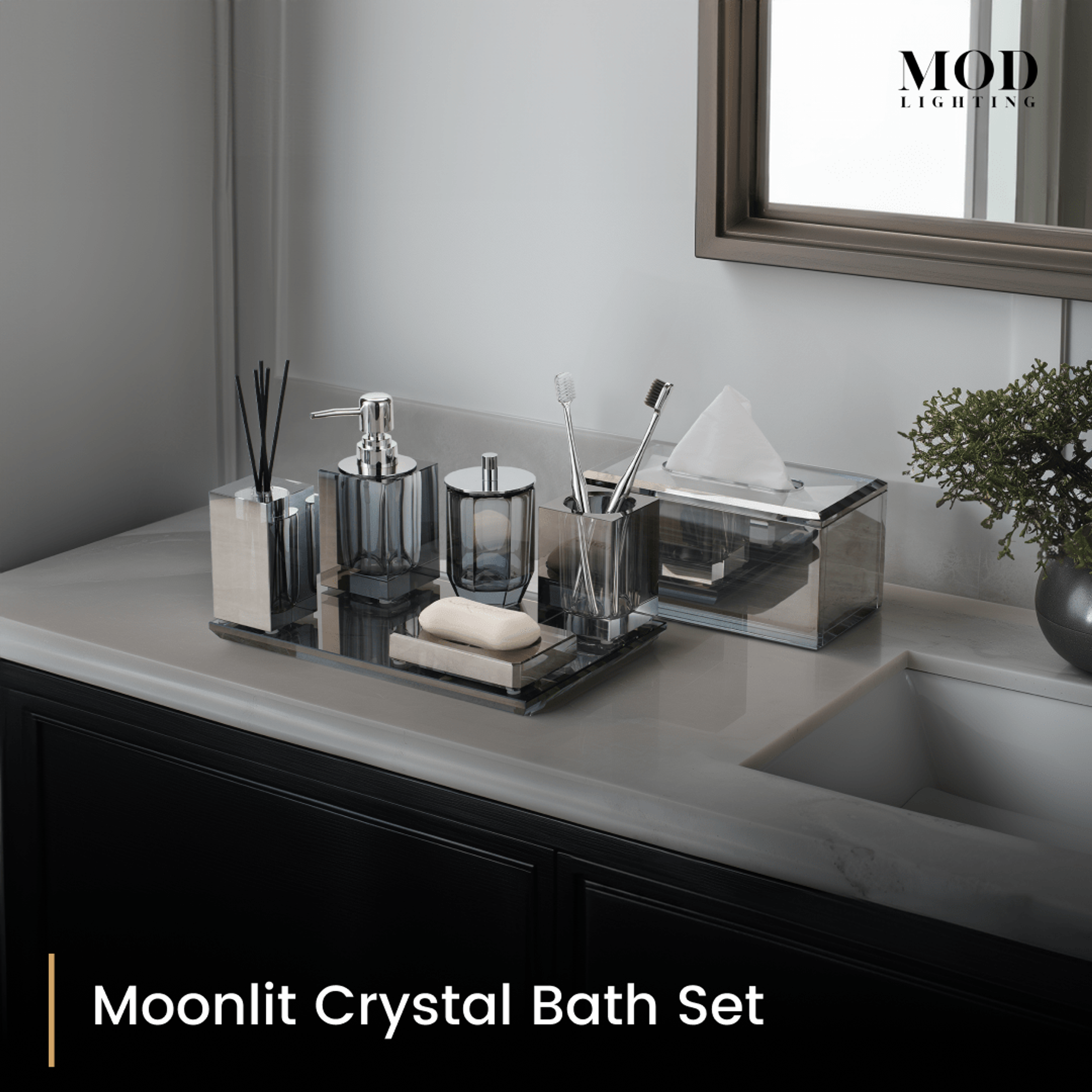 Moonlit Crystal Bath Set with matching tissue box on a mirrored tray on a dark vanity by an undermount sink