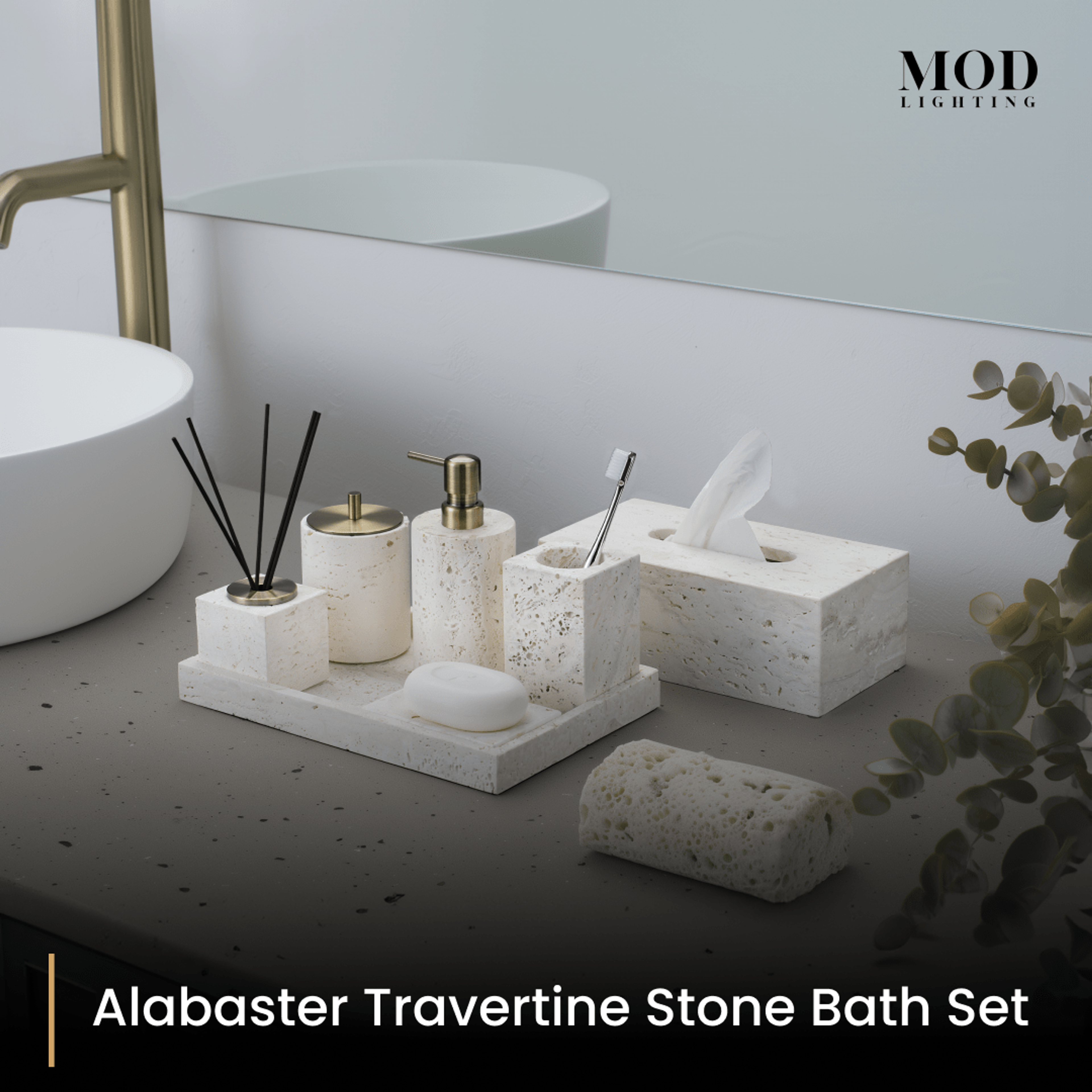 Alabaster Travertine bath set with tissue box and tray on a dark vanity beside a basin and eucalyptus