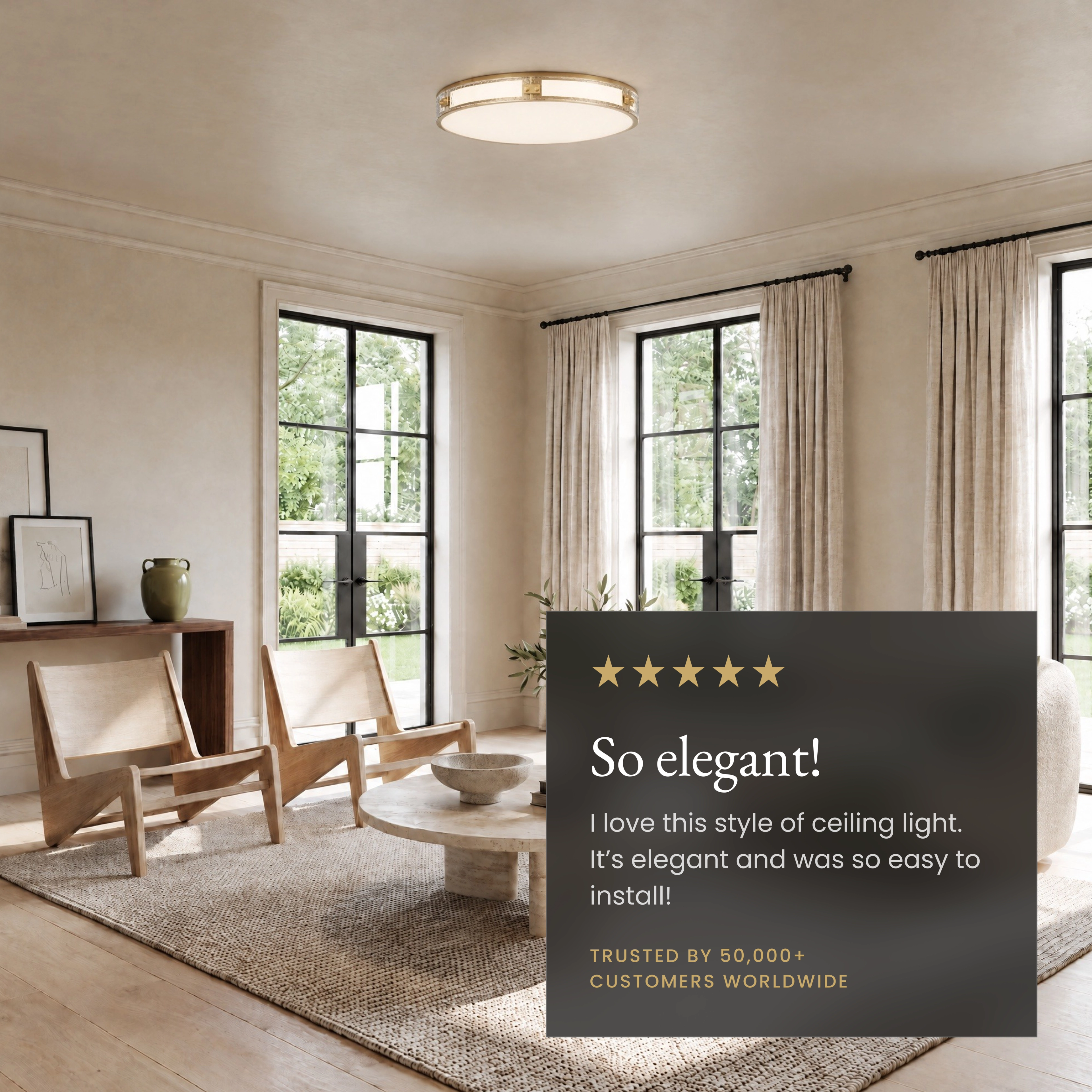 Orielle brushed-gold crystal flush-mount on ceiling above a sofa, labeled slant-ceiling ready and dimmable