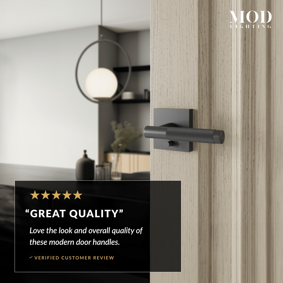Belmont matte-black modern lever door handle on a wood door, glowing MOD LIGHTING pendant behind