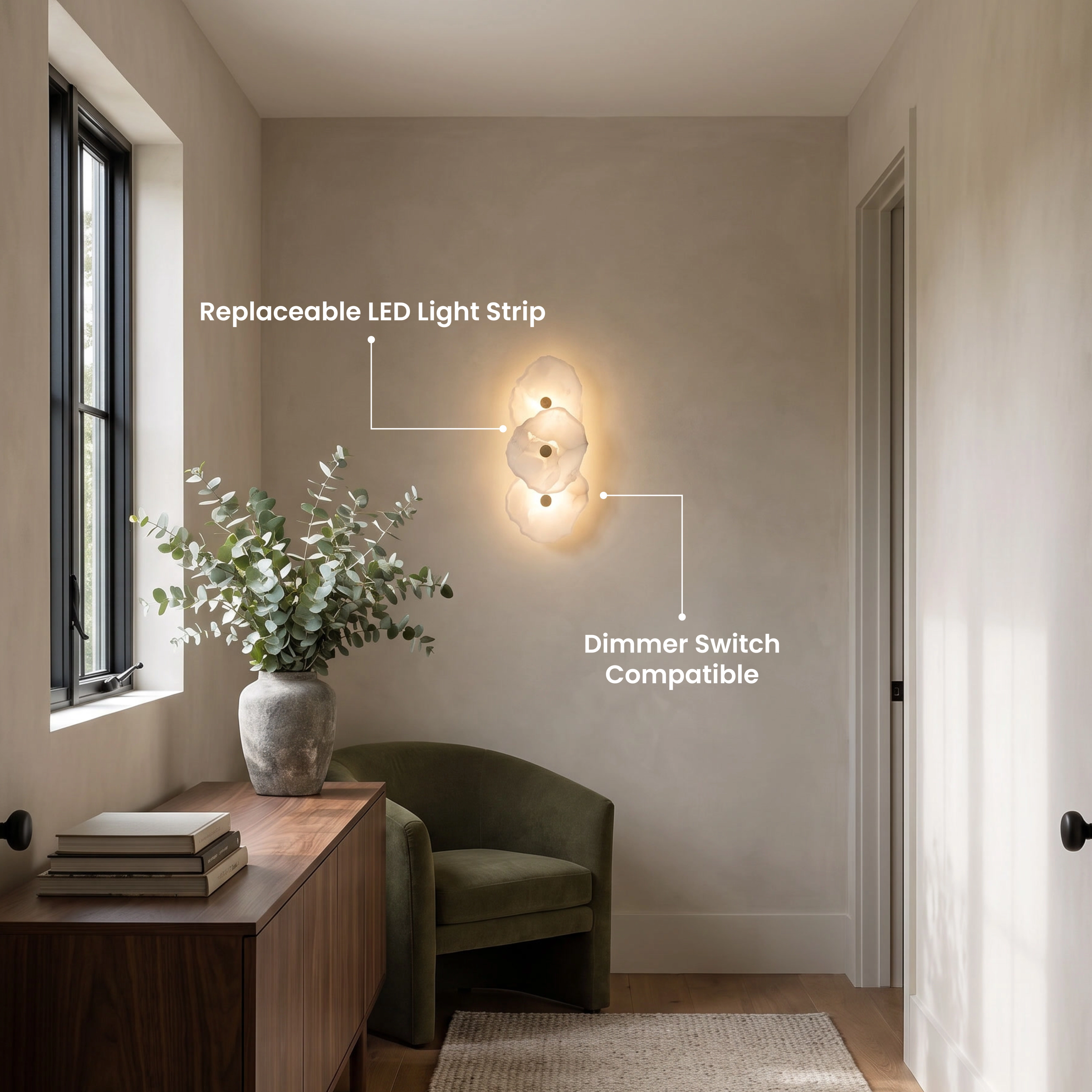 Alba Sconce, tall column of stacked alabaster-petal discs glowing on a stone-lined entryway wall