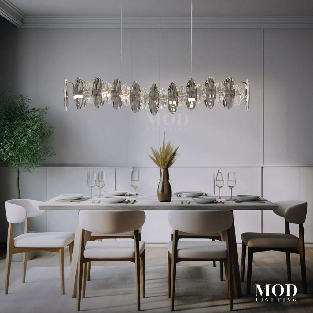 Celestial linear crystal chandelier with clear and smoke oval crystals over a set dining table