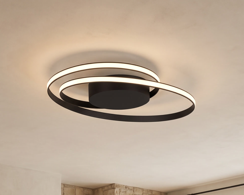 Spiral, a ring and spiral ceiling light, in a dining room